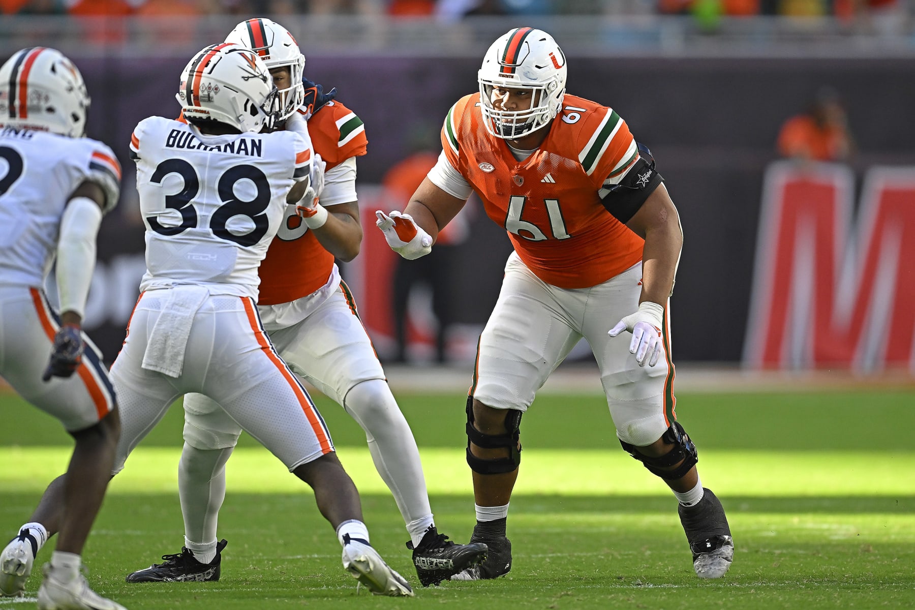 MIAMI GARDENS, FL - OCTOBER 28:  Miami offensive lineman Francis Mauigoa (61) defends the line in the third quarter as the Miami Hurricanes faced the Virginia Cavaliers on October 28, 2023, at Hard Rock Stadium in Miami Gardens, Florida. (Photo by Samuel Lewis/Icon Sportswire via Getty Images)