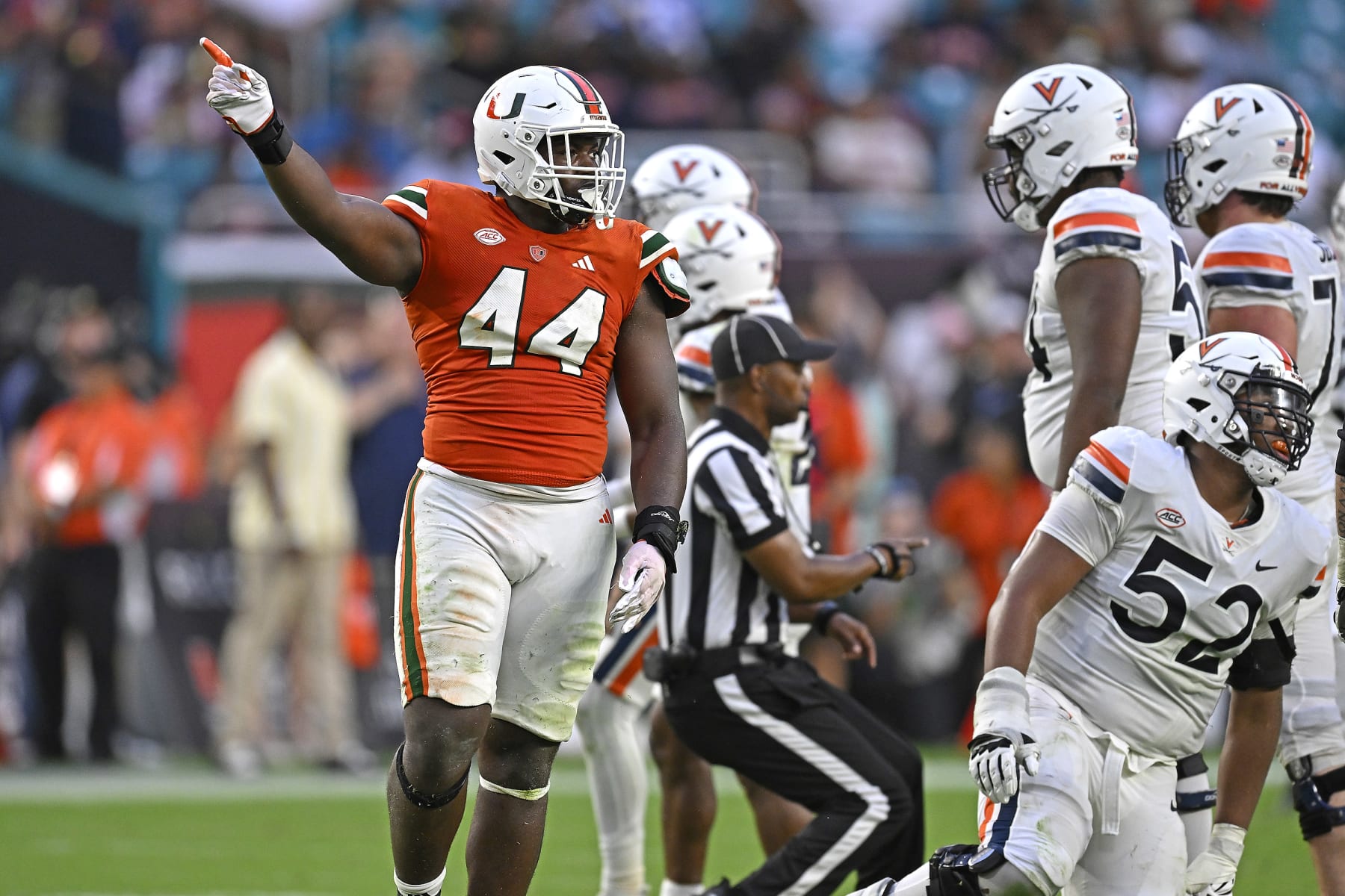 MIAMI GARDENS, FL - OCTOBER 28:  Miami defensive lineman Rueben Bain, Jr. (44) celebrates after a key defensive stop in overtime as the Miami Hurricanes faced the Virginia Cavaliers on October 28, 2023, at Hard Rock Stadium in Miami Gardens, Florida. (Photo by Samuel Lewis/Icon Sportswire via Getty Images)