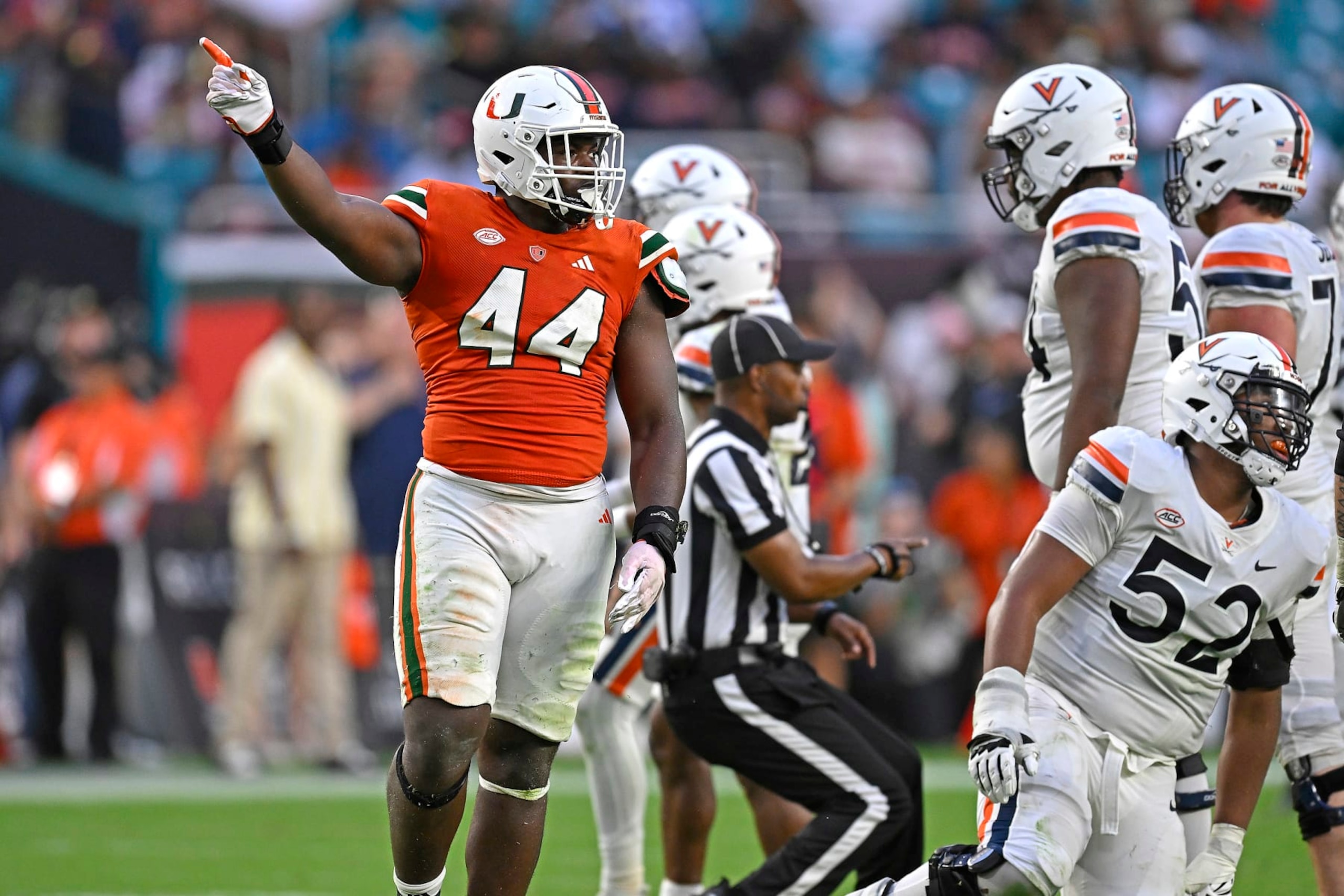 MIAMI GARDENS, FL - OCTOBER 28: Miami defensive lineman Rueben Bain, Jr. (44) celebrates after a key defensive stop in overtime as the Miami Hurricanes faced the Virginia Cavaliers on October 28, 2023, at Hard Rock Stadium in Miami Gardens, Florida. (Photo by Samuel Lewis/Icon Sportswire via Getty Images) MIAMI GARDENS, FL - OCTOBER 28: Miami defensive lineman Rueben Bain, Jr. (44) celebrates after a key defensive stop in overtime as the Miami Hurricanes faced the Virginia Cavaliers on October 28, 2023, at Hard Rock Stadium in Miami Gardens, Florida. (Photo by Samuel Lewis/Icon Sportswire via Getty Images)