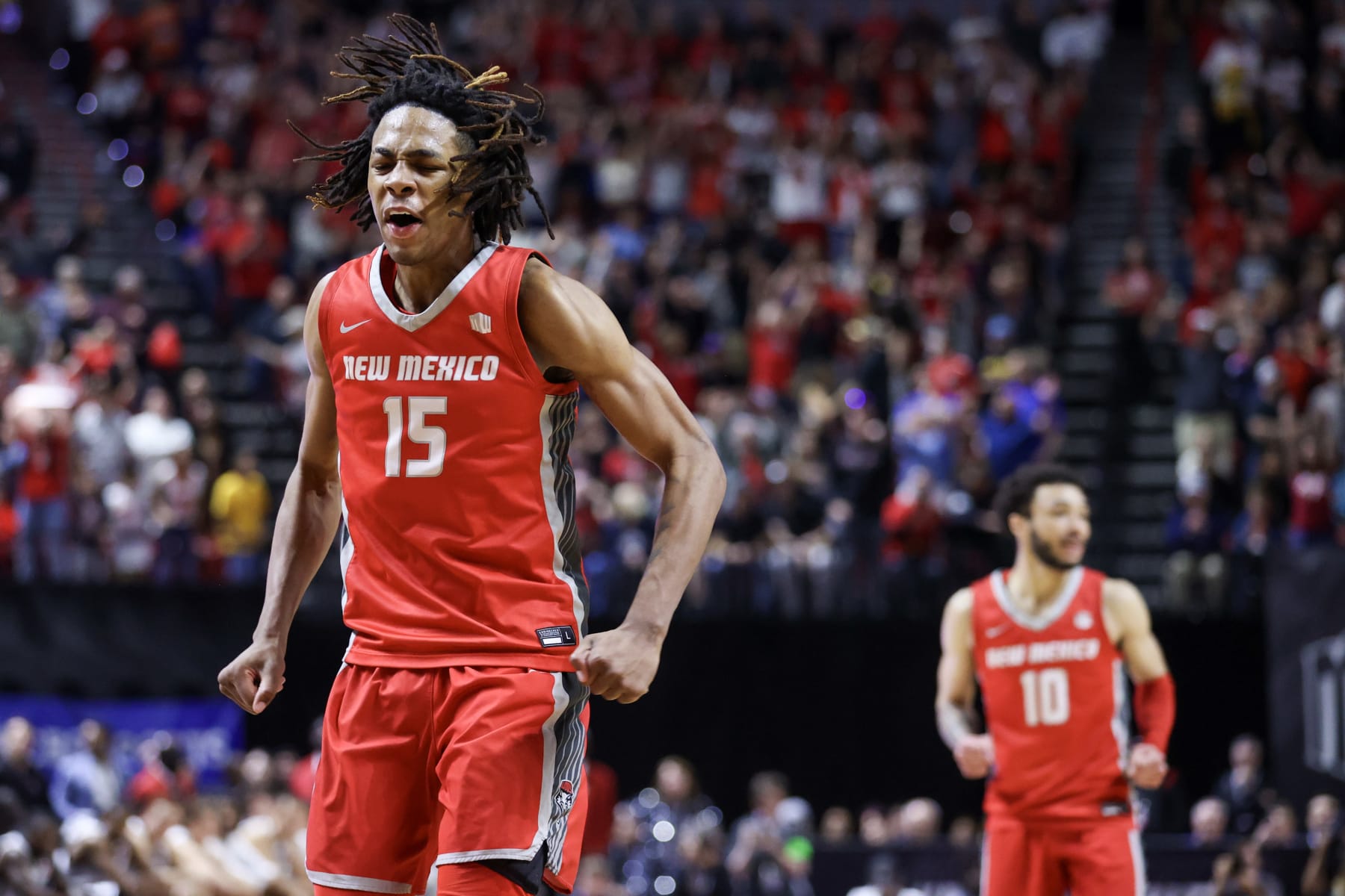 LAS VEGAS, NEVADA - MARCH 16: JT Toppin #15 of the New Mexico Lobos celebrates after making a basket against the San Diego State Aztecs during the second half of the championship game of the Mountain West basketball tournament at the Thomas & Mack Center on March 16, 2024 in Las Vegas, Nevada. (Photo by Ian Maule/Getty Images)