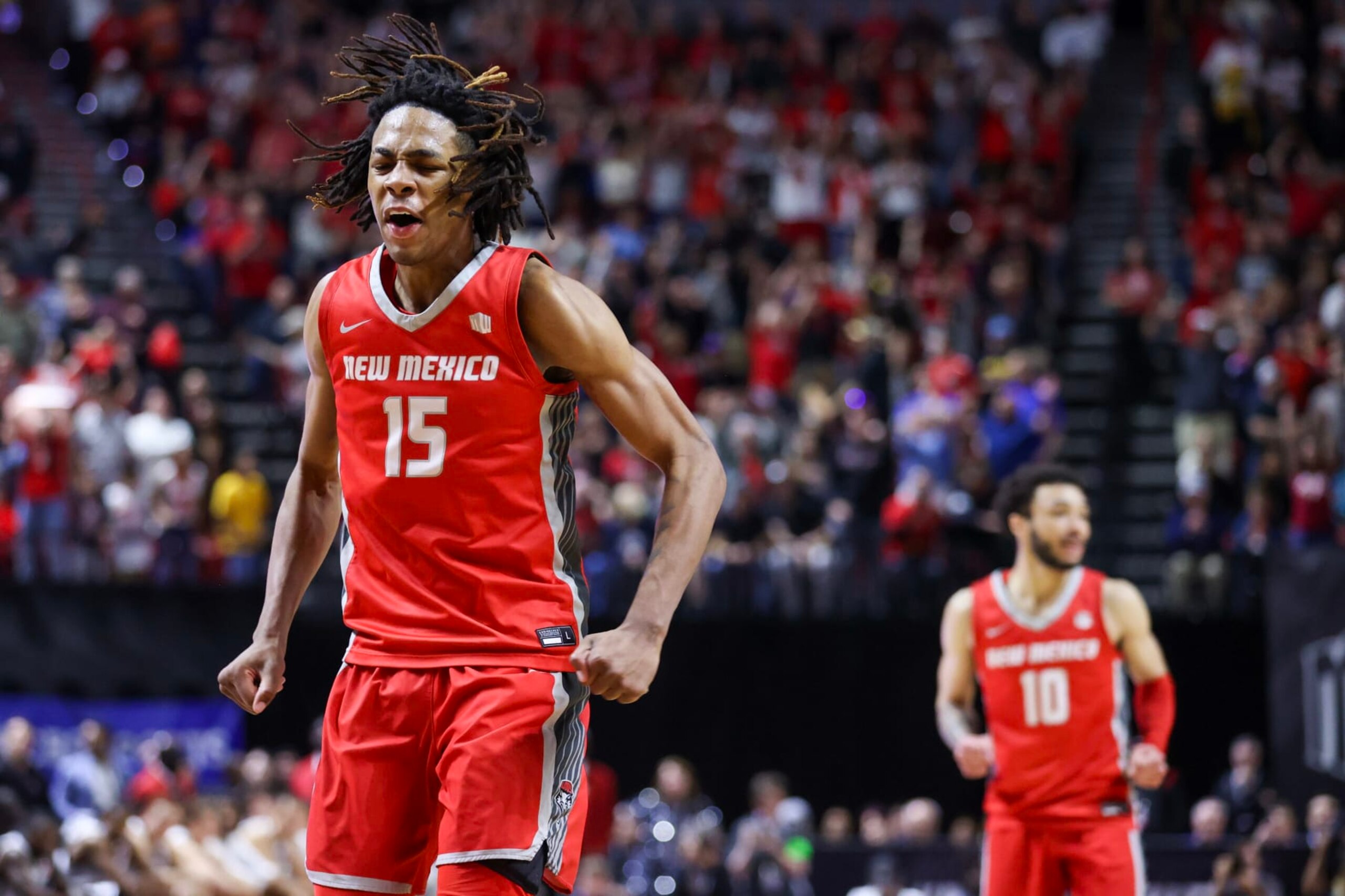 LAS VEGAS, NEVADA - MARCH 16: JT Toppin #15 of the New Mexico Lobos celebrates after making a basket against the San Diego State Aztecs during the second half of the championship game of the Mountain West basketball tournament at the Thomas & Mack Center on March 16, 2024 in Las Vegas, Nevada. (Photo by Ian Maule/Getty Images) LAS VEGAS, NEVADA - MARCH 16: JT Toppin #15 of the New Mexico Lobos celebrates after making a basket against the San Diego State Aztecs during the second half of the championship game of the Mountain West basketball tournament at the Thomas & Mack Center on March 16, 2024 in Las Vegas, Nevada. (Photo by Ian Maule/Getty Images)
