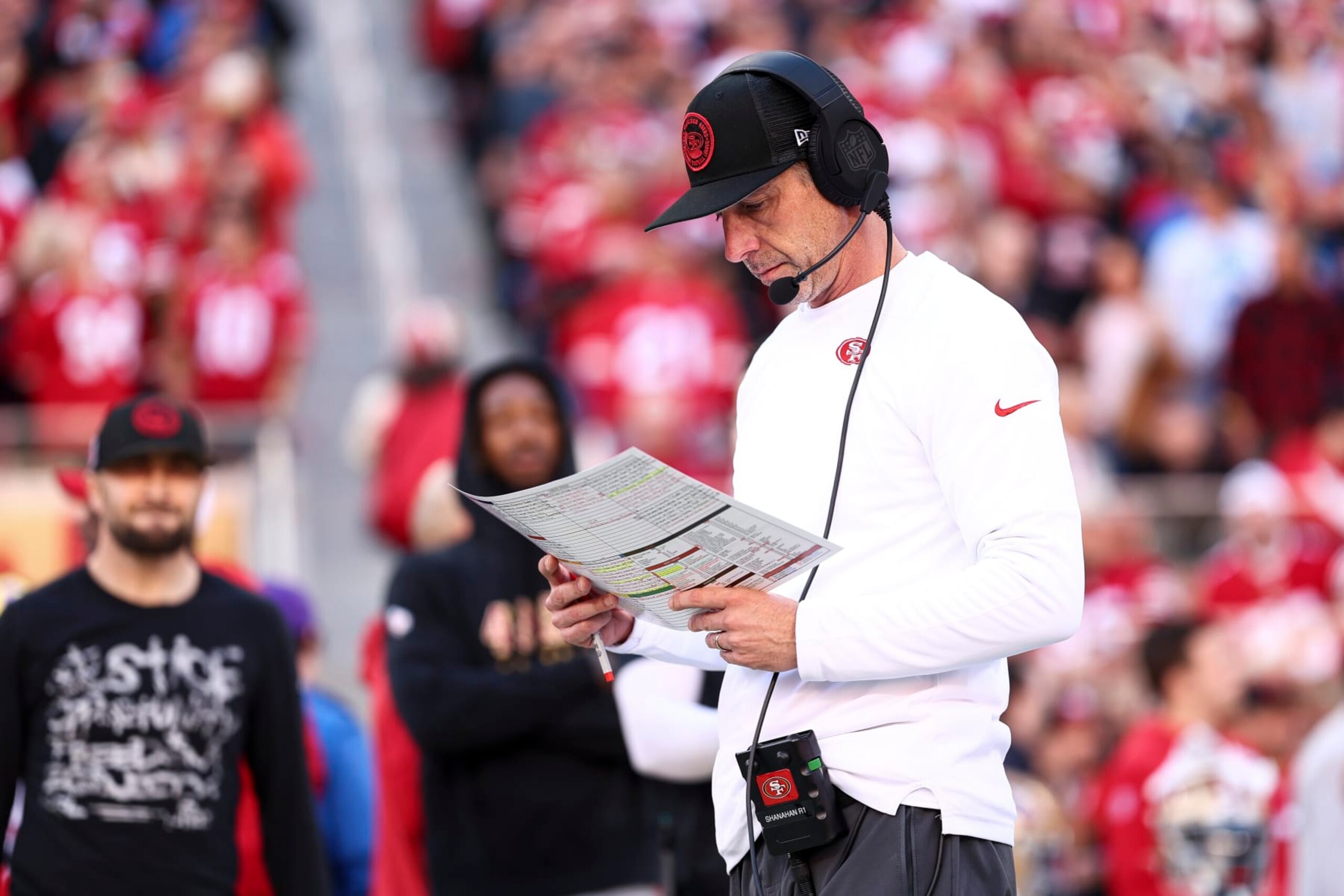 SANTA CLARA, CA - JANUARY 28: Head coach Kyle Shanahan of the San Francisco 49ers reads his play sheet prior to the NFC Championship NFL football game against the Detroit Lions at Levi's Stadium on January 28, 2024 in Santa Clara, California. (Photo by Kevin Sabitus/Getty Images)