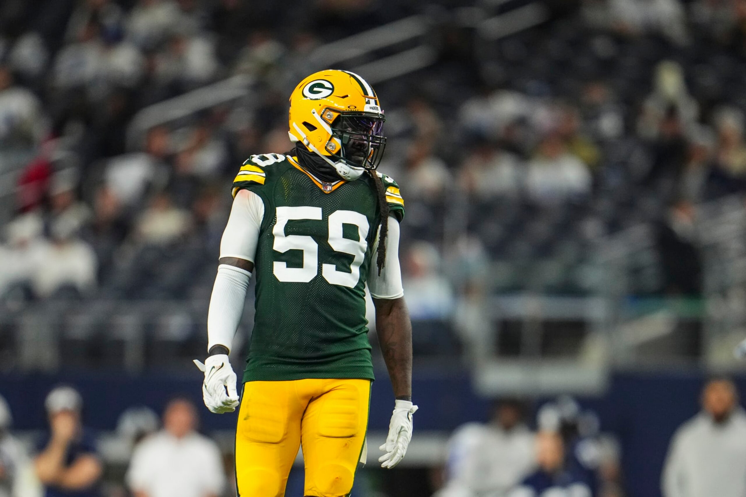 DALLAS, TX - JANUARY 14: De'Vondre Campbell #59 of the Green Bay Packers lines up during an NFL wild-card playoff football game against the Dallas Cowboys at AT&T Stadium on January 14, 2024 in Dallas, Texas. (Photo by Cooper Neill/Getty Images)