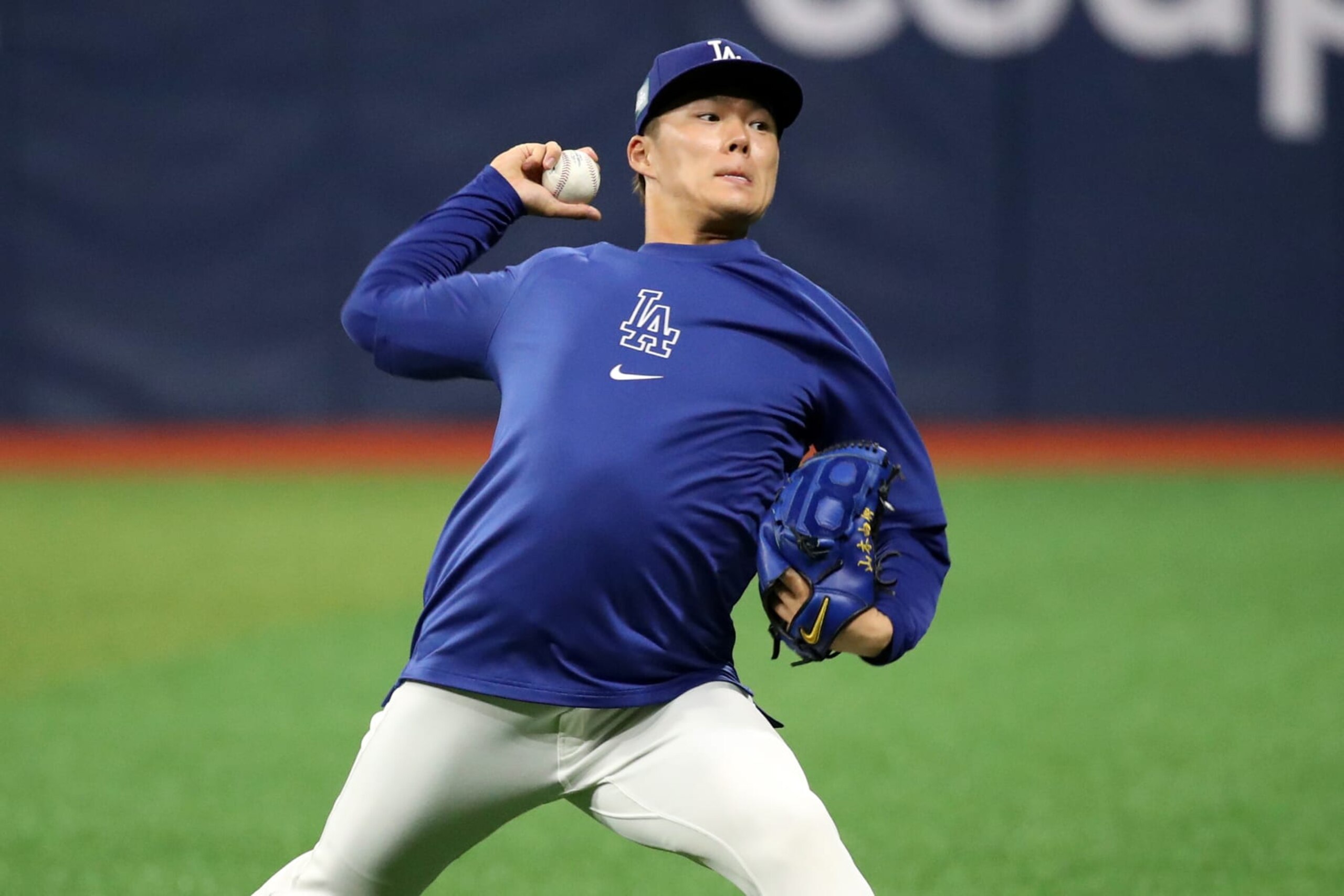 SEOUL, SOUTH KOREA - MARCH 17: Yoshinobu Yamamoto #18 of the Los Angeles Dodgers warms up prior to the exhibition game between Los Angeles Dodgers and Kiwoom Heroes at Gocheok Sky Dome on March 17, 2024 in Seoul, South Korea. (Photo by Chung Sung-Jun/Getty Images)