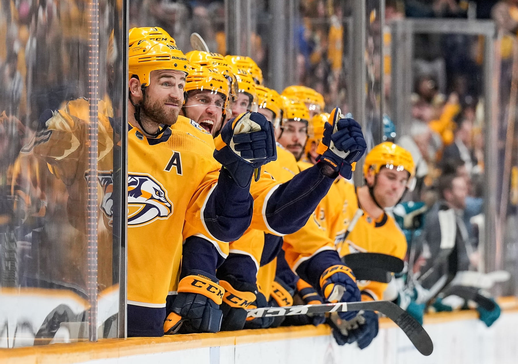 NASHVILLE, TENNESSEE - MARCH 19: Ryan O'Reilly #90 of the Nashville Predators celebrates a goal by Michael McCarron #47 against the San Jose Sharks during an NHL game at Bridgestone Arena on March 19, 2024 in Nashville, Tennessee. (Photo by John Russell/NHLI via Getty Images)