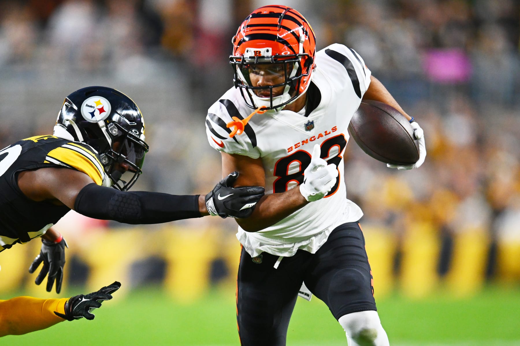 PITTSBURGH, PENNSYLVANIA - DECEMBER 23: Tyler Boyd #83 of the Cincinnati Bengals runs with the ball during the first quarter of a game against the Pittsburgh Steelers at Acrisure Stadium on December 23, 2023 in Pittsburgh, Pennsylvania. (Photo by Joe Sargent/Getty Images)