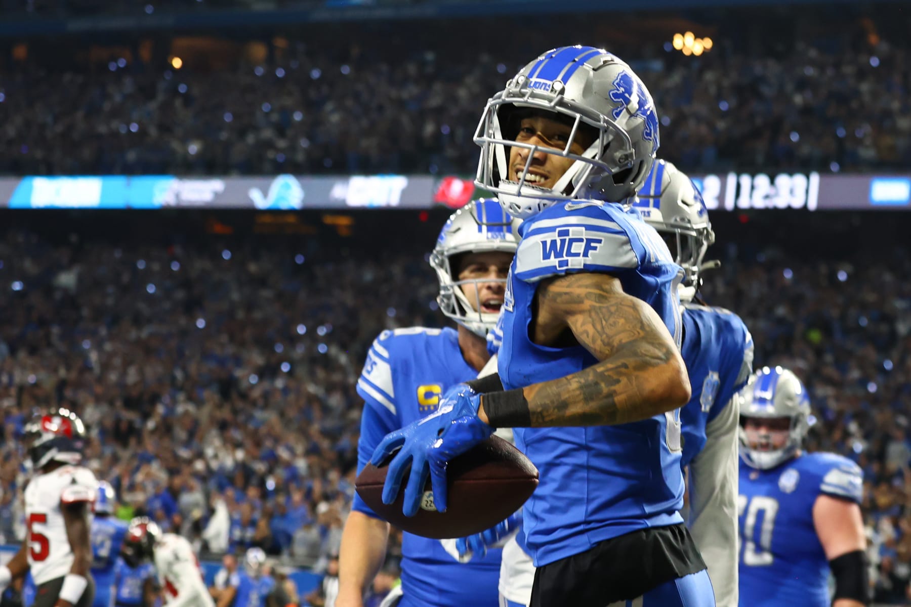 DETROIT, MI - JANUARY 21:  Detroit Lions wide receiver Josh Reynolds (8) smiles after catching a touchdown pass during an NFL NFC Divisional playoff football game between the Tampa Bay Buccaneers and the Detroit Lions on January 21, 2024 at Ford Field in Detroit, Michigan. (Photo by Scott W. Grau/Icon Sportswire via Getty Images)