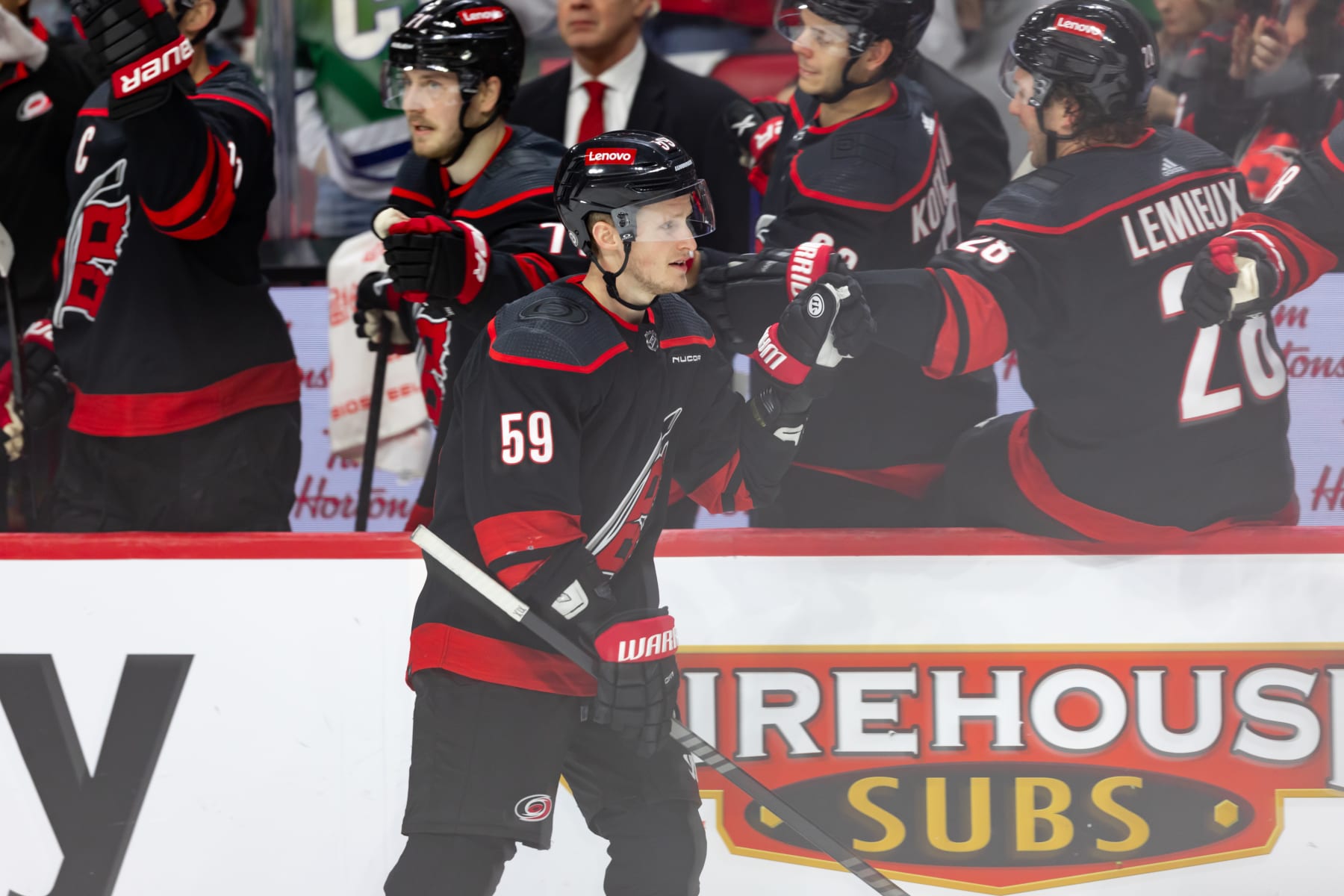 OTTAWA, ON - MARCH 17: Carolina Hurricanes Left Wing Jake Guentzel (59) skates by the bench to celebrate his goal during third period National Hockey League action between the Carolina Hurricanes and Ottawa Senators on March 17, 2024, at Canadian Tire Centre in Ottawa, ON, Canada. (Photo by Richard A. Whittaker/Icon Sportswire via Getty Images)