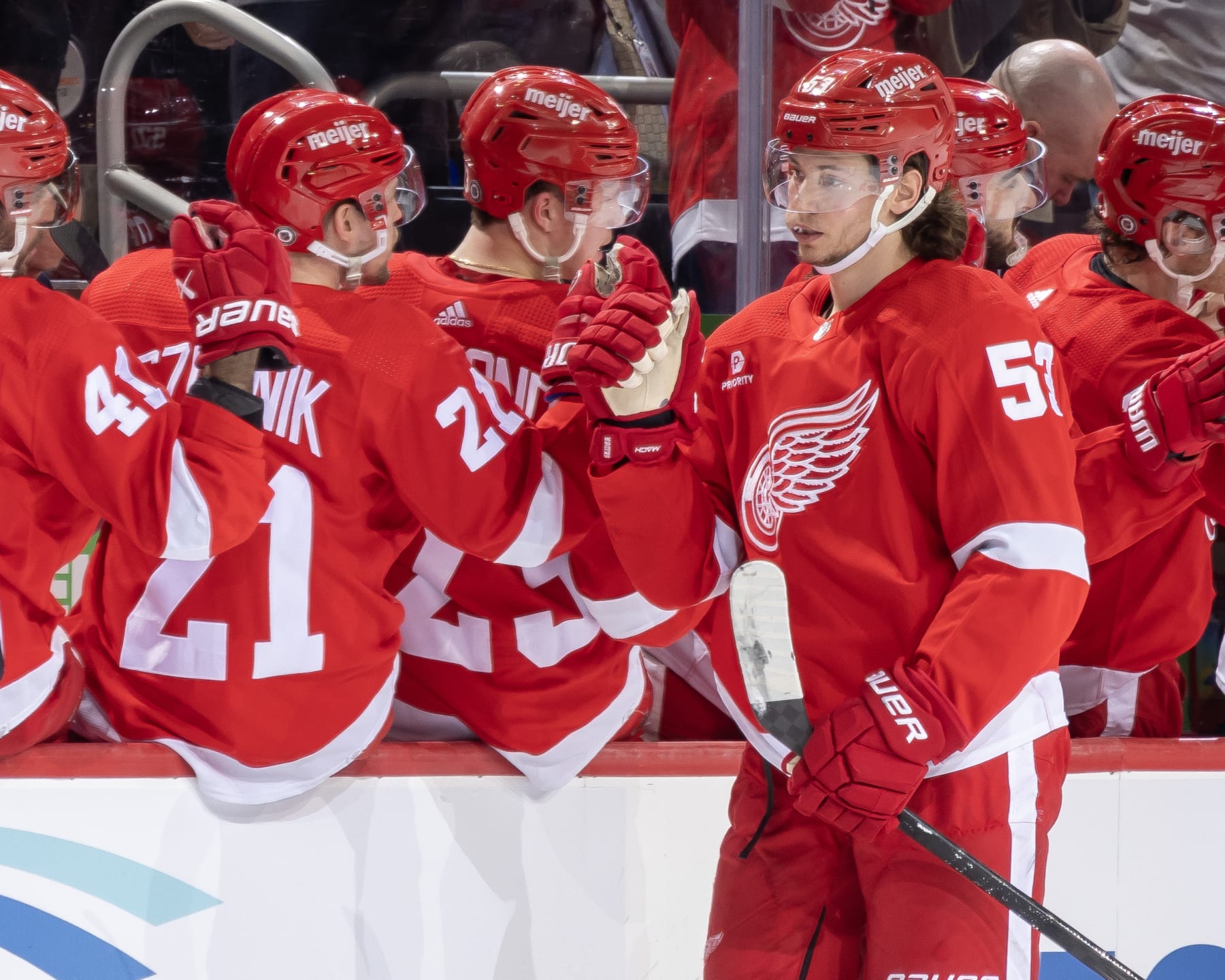 DETROIT, MI - MARCH 19: Moritz Seider (53) of the Detroit Red Wings celebrates his goal against the Columbus Blue Jackets with teammates on the bench during the second period at Little Caesars Arena on March 19, 2024 in Detroit, Michigan. (Photo by Dave Reginek/NHLI via Getty Images)
