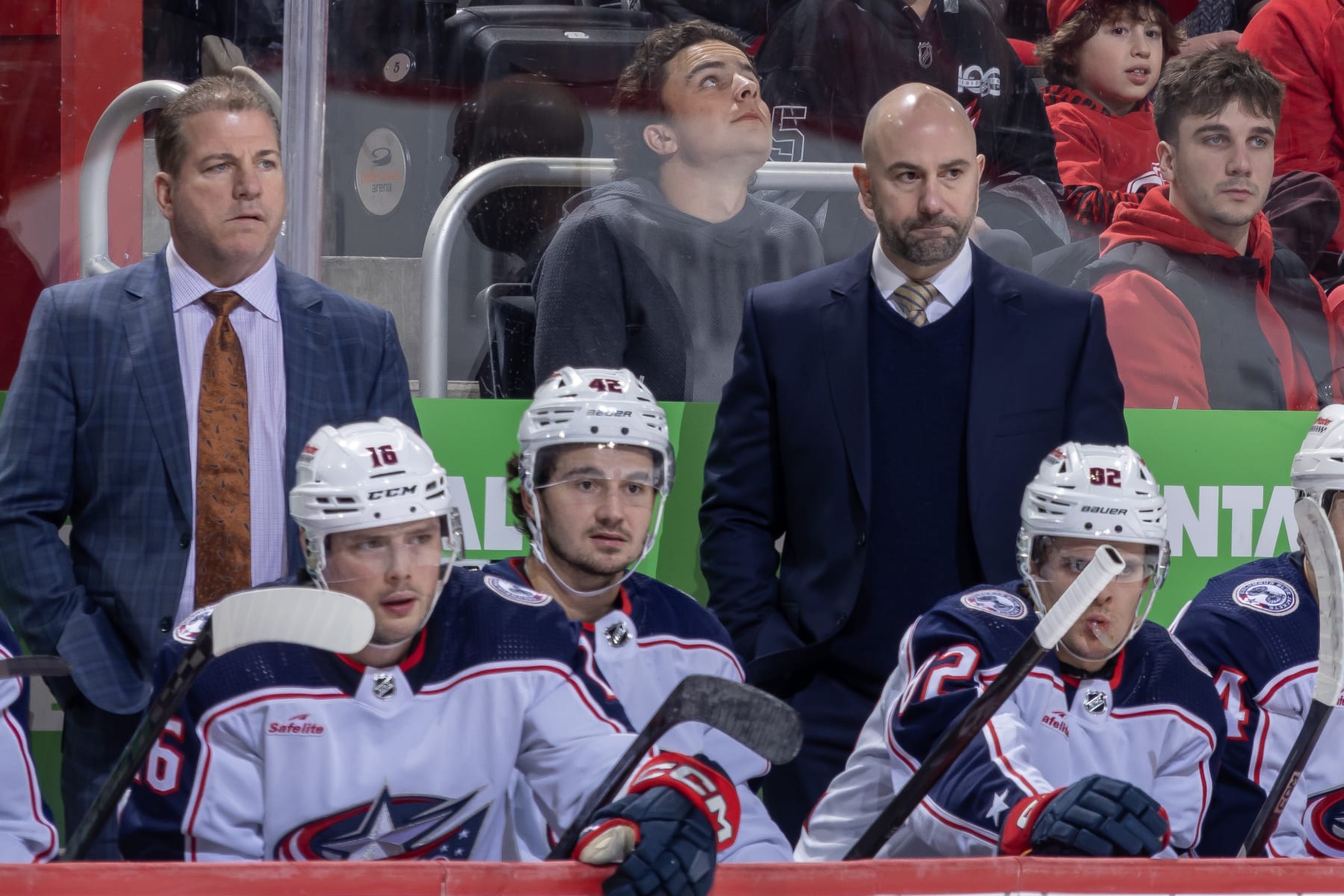 DETROIT, MI - MARCH 19: Head Coach Pascal Vincent of the Columbus Blue Jackets (R) and Assistant Coach Mark Recchi watches the action from the bench against the Detroit Red Wings during the second period at Little Caesars Arena on March 19, 2024 in Detroit, Michigan. (Photo by Dave Reginek/NHLI via Getty Images)