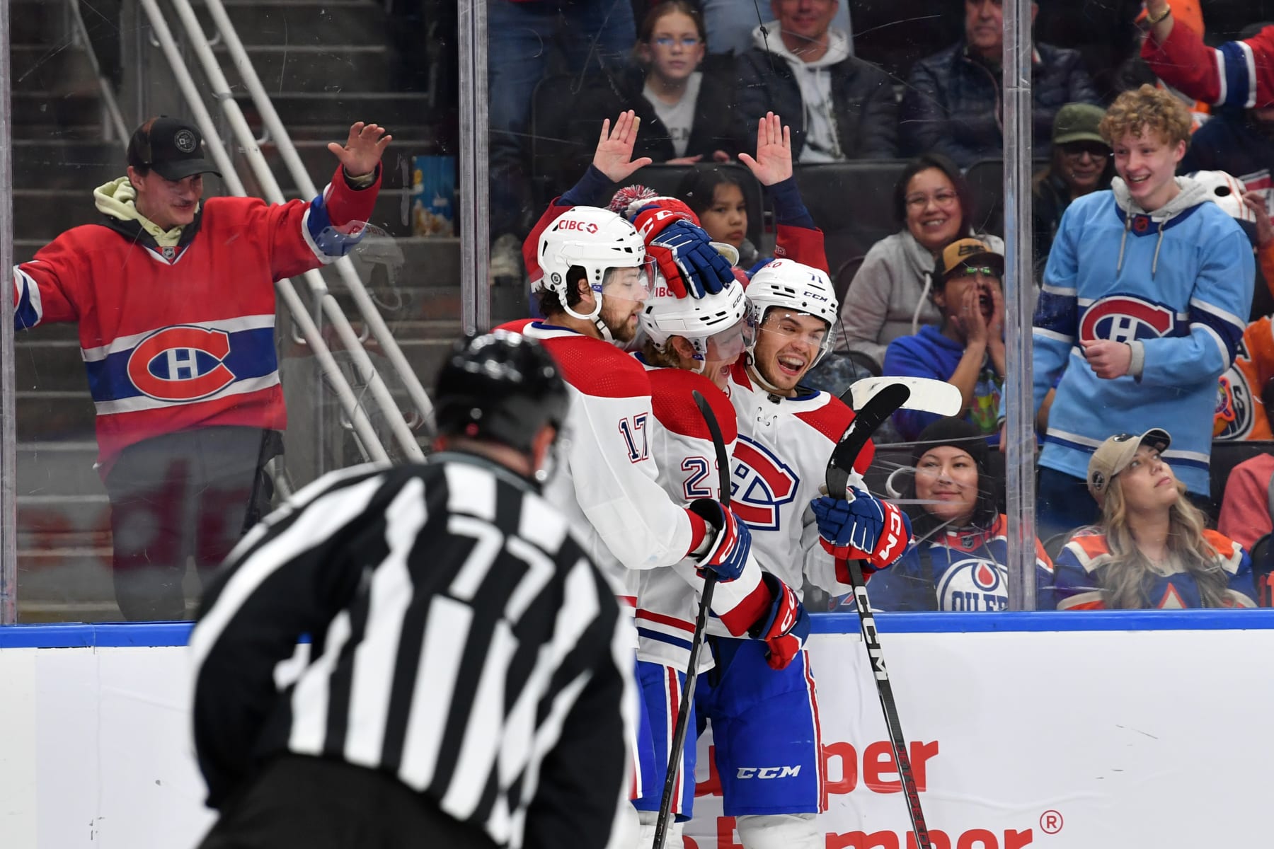 EDMONTON, CANADA - MARCH 19: Kaiden Guhle #21 of the Montreal Canadiens celebrates his third-period goal against the Edmonton Oilers with teammates Josh Anderson #17 and Jake Evans #71 at Rogers Place on March 19, 2024, in Edmonton, Alberta, Canada. (Photo by Andy Devlin/NHLI via Getty Images)