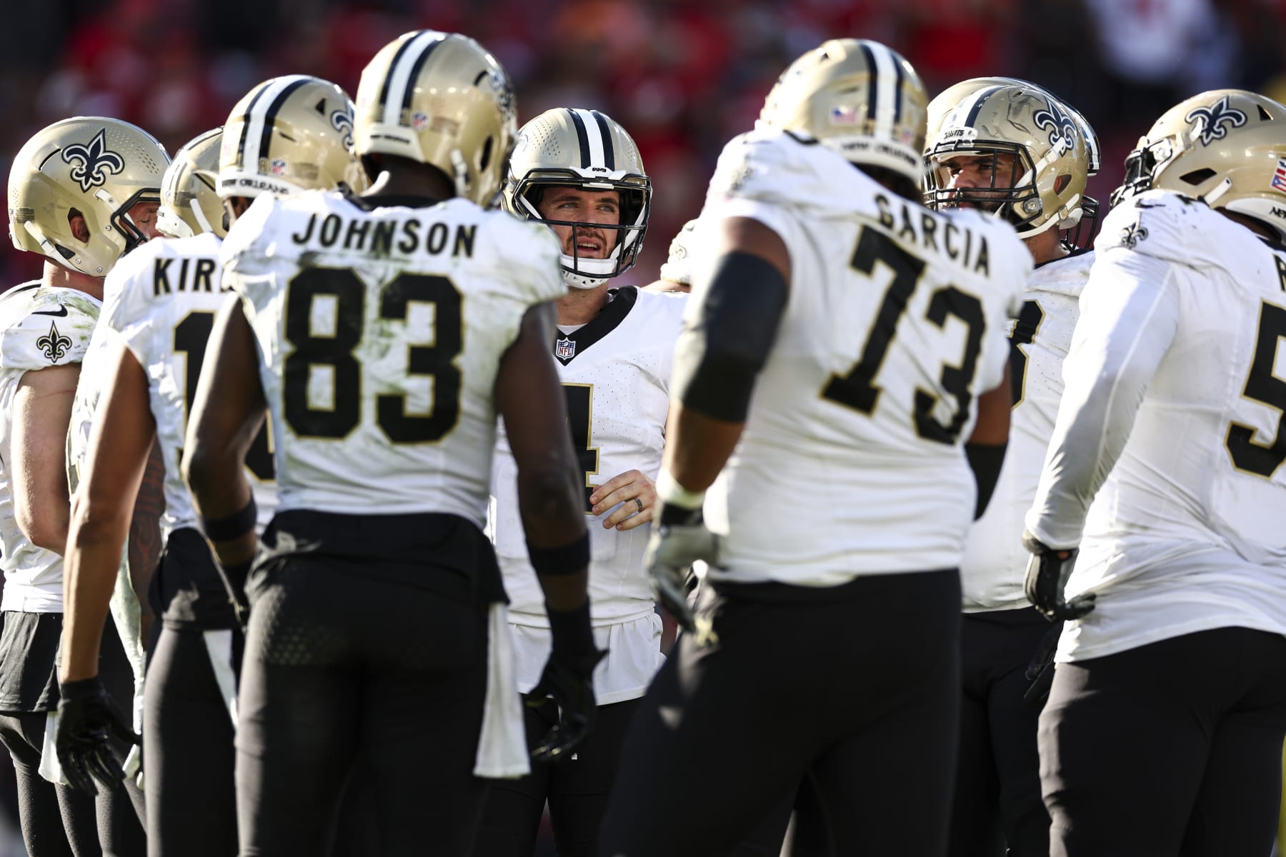 TAMPA, FL - DECEMBER 31: Derek Carr #4 of the New Orleans Saints huddles with the rest of the offense during the fourth quarter of an NFL football game against the Tampa Bay Buccaneers at Raymond James Stadium on December 31, 2023 in Tampa, Florida. (Photo by Kevin Sabitus/Getty Images)