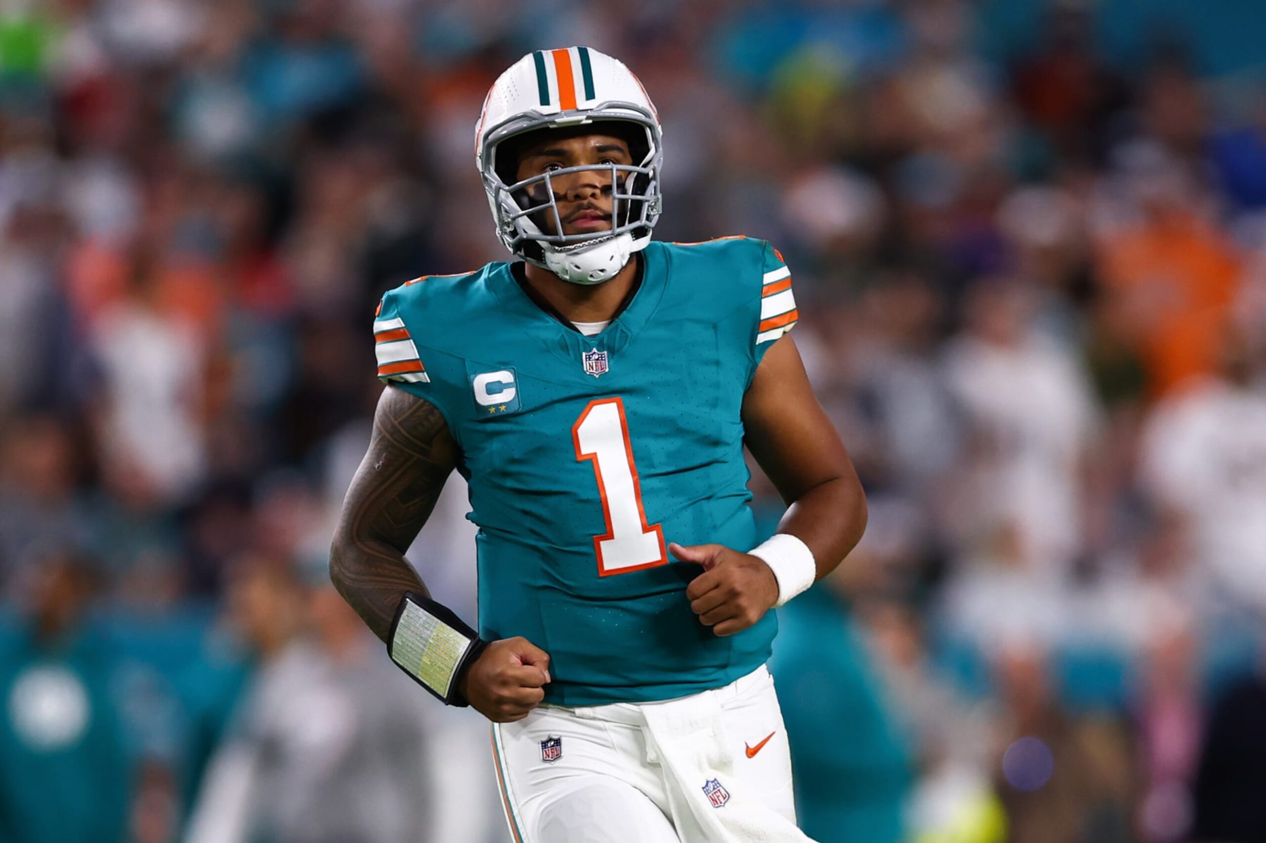 MIAMI GARDENS, FLORIDA - DECEMBER 24: Tua Tagovailoa #1 of the Miami Dolphins looks on against the Dallas Cowboys during the first half of the game at Hard Rock Stadium on December 24, 2023 in Miami Gardens, Florida. (Photo by Megan Briggs/Getty Images)
