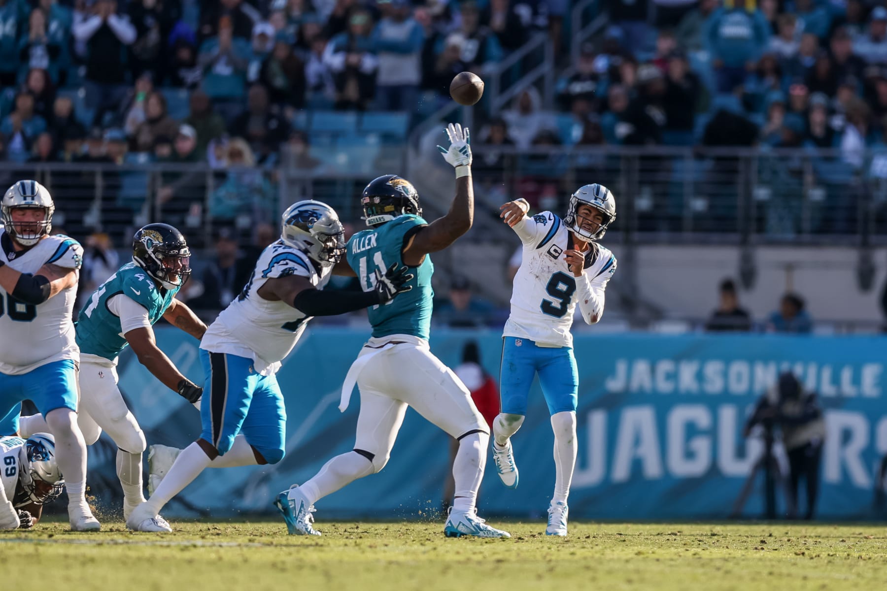 JACKSONVILLE, FLORIDA - DECEMBER 31: Bryce Young #9 of the Carolina Panthers throws over Josh Allen #41 of the Jacksonville Jaguars during the second half of the game at EverBank Stadium on December 31, 2023 in Jacksonville, Florida. (Photo by Mike Carlson/Getty Images)
