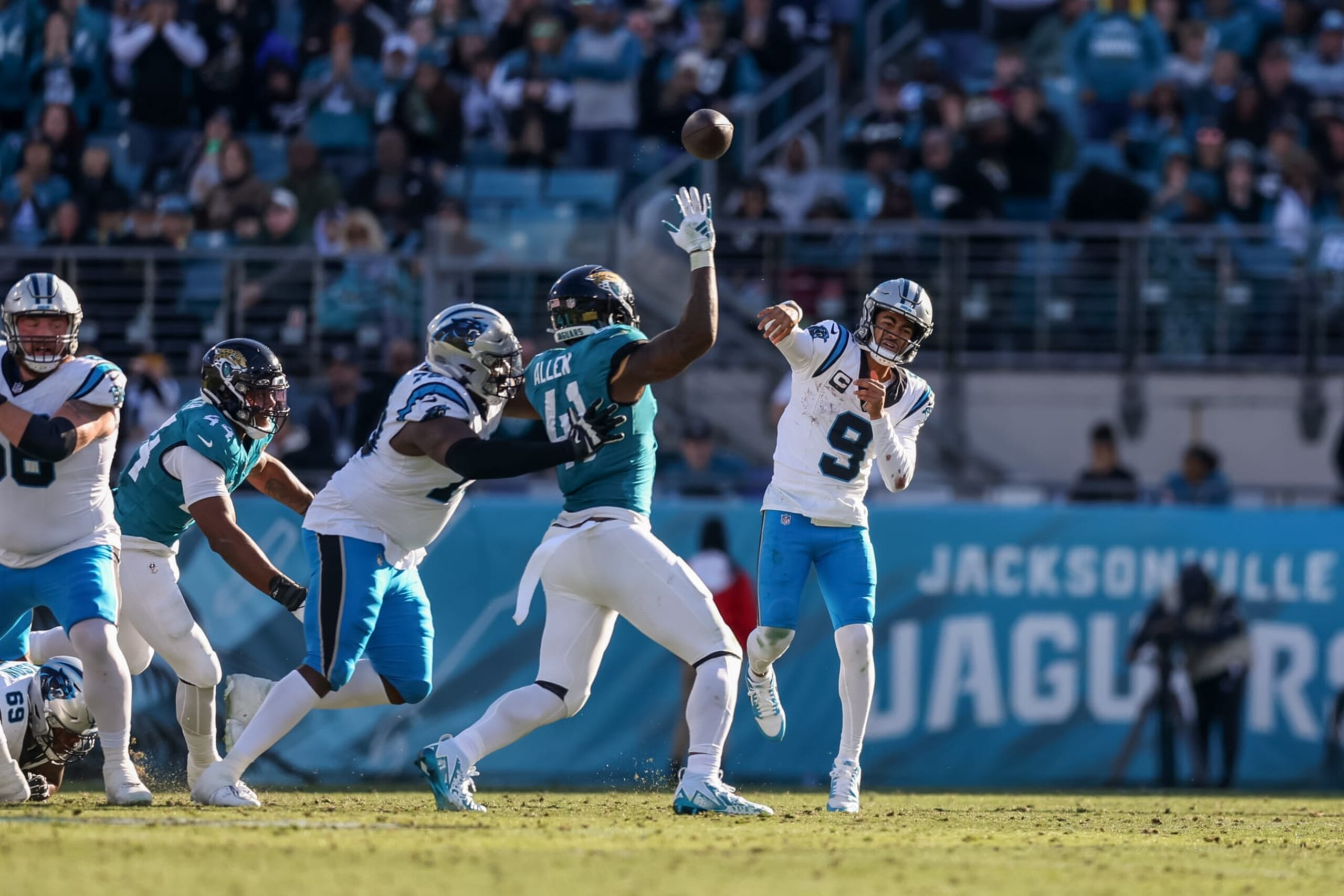 JACKSONVILLE, FLORIDA - DECEMBER 31: Bryce Young #9 of the Carolina Panthers throws over Josh Allen #41 of the Jacksonville Jaguars during the second half of the game at EverBank Stadium on December 31, 2023 in Jacksonville, Florida. (Photo by Mike Carlson/Getty Images)
