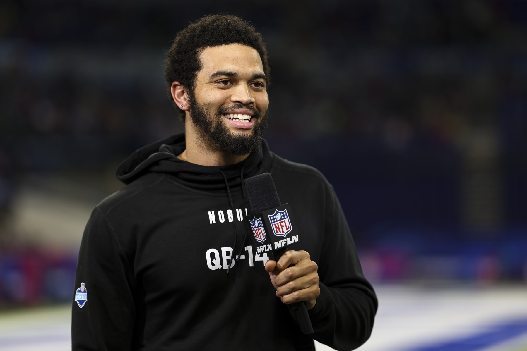 INDIANAPOLIS, INDIANA - MARCH 2: Caleb Williams #QB14 of Southern California smiles while doing an interview with NFL Network during the NFL Combine at the Indiana Convention Center on March 2, 2024 in Indianapolis, Indiana. (Photo by Kevin Sabitus/Getty Images)