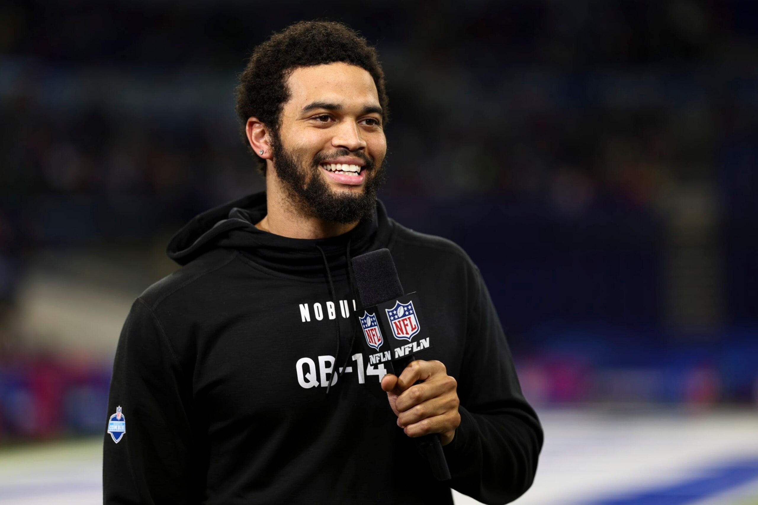 INDIANAPOLIS, INDIANA - MARCH 2: Caleb Williams #QB14 of Southern California smiles while doing an interview with NFL Network during the NFL Combine at the Indiana Convention Center on March 2, 2024 in Indianapolis, Indiana. (Photo by Kevin Sabitus/Getty Images)