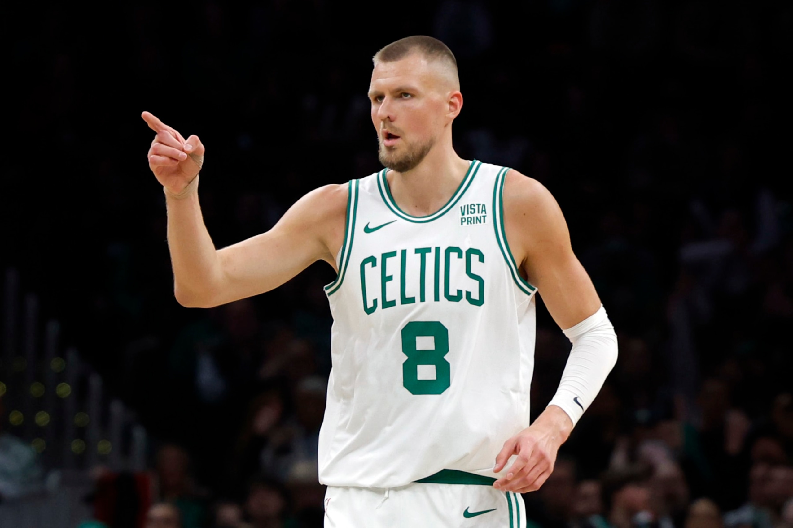 Boston, MA - March 18: Boston Celtics center Kristaps Porzingis reacts after making a 3-pointer in the fourth quarter. The Celtics beat the Detroit Pistons, 119-94. (Photo by Danielle Parhizkaran/The Boston Globe via Getty Images)