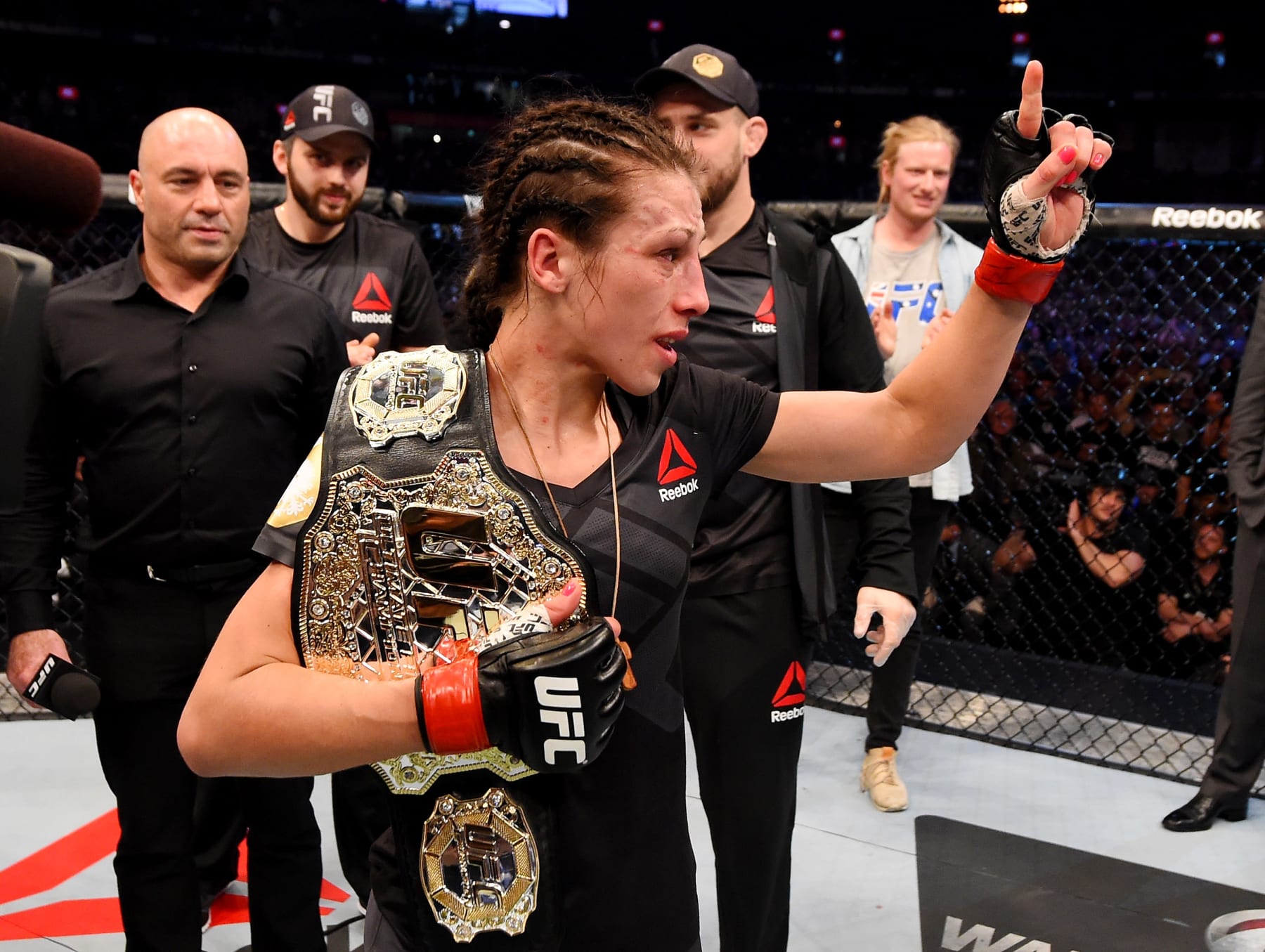 Joanna Jedrzejczyk celebrates a successful title defense against Valerie Letourneau in Australia.