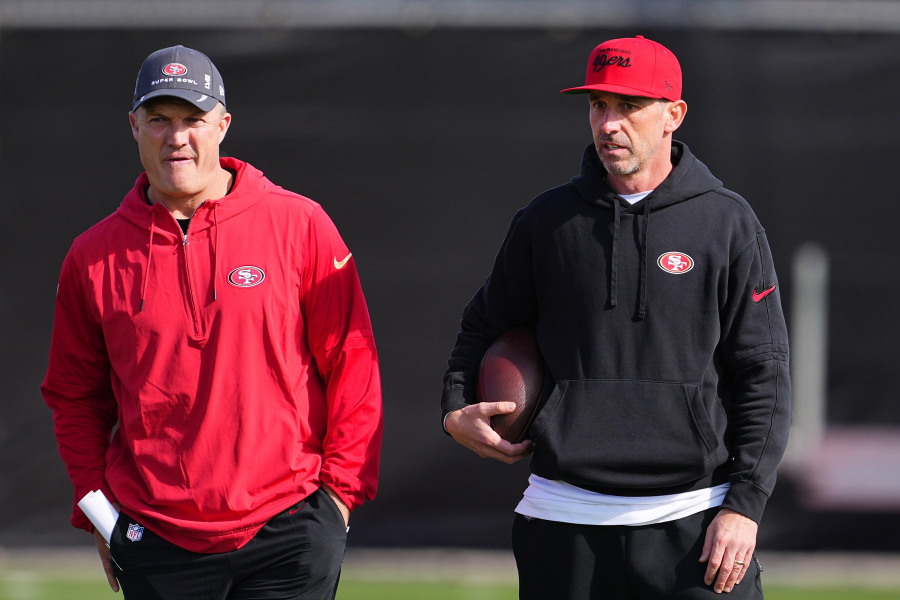 LAS VEGAS, NEVADA - FEBRUARY 08: (L-R) General manager John Lynch and head coach Kyle Shanahan look on during San Francisco 49ers practice ahead of Super Bowl LVIII at Fertitta Football Complex on February 07, 2024 in Las Vegas, Nevada. (Photo by Chris Unger/Getty Images)