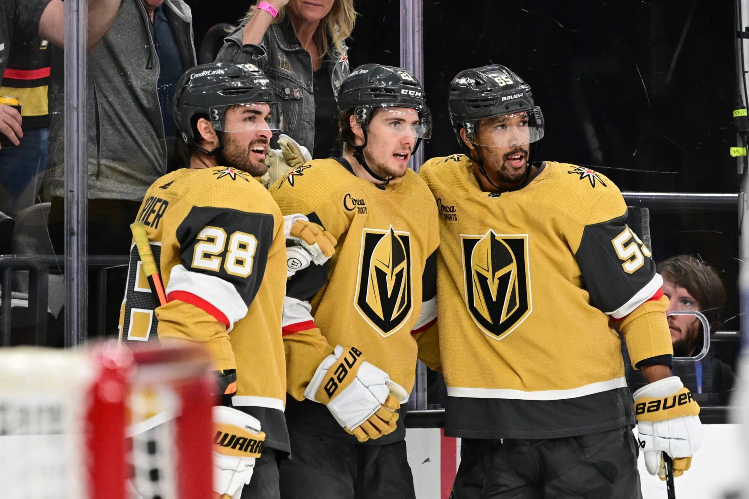 LAS VEGAS, NEVADA - MARCH 19: Brett Howden #21 of the Vegas Golden Knights celebrates his goal William Carrier #28 and and Keegan Kolesar #55 against the Tampa Bay Lightning in the second period at T-Mobile Arena on March 19, 2024 in Las Vegas, Nevada. (Photo by Candice Ward/Getty Images)