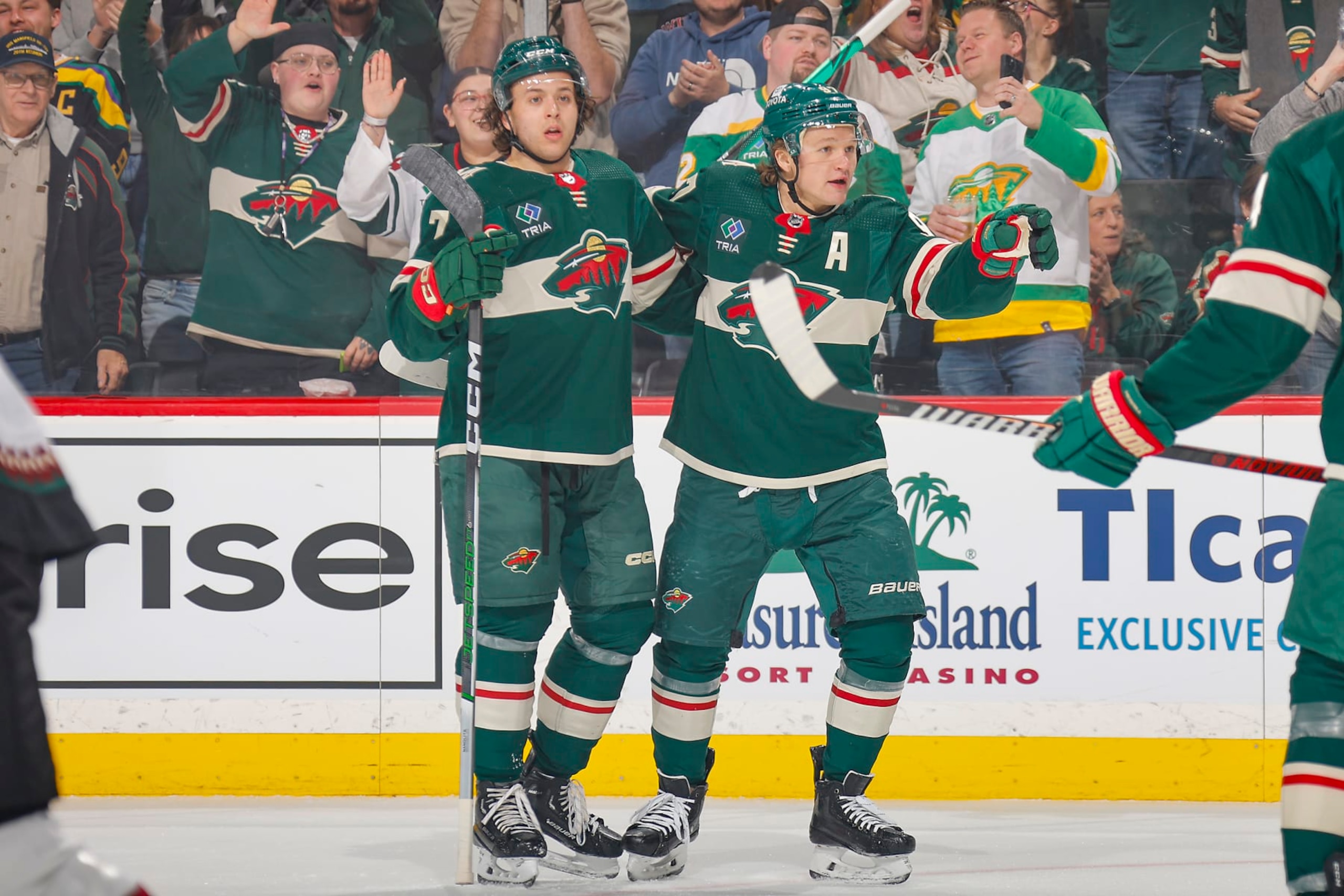 SAINT PAUL, MN - MARCH 12: Kirill Kaprizov #97 celebrates his goal with his teammate Brock Faber #7 of the Minnesota Wild against the Arizona Coyotes during the game at the Xcel Energy Center on March 12, 2024 in Saint Paul, Minnesota. (Photo by Bruce Kluckhohn/NHLI via Getty Images)