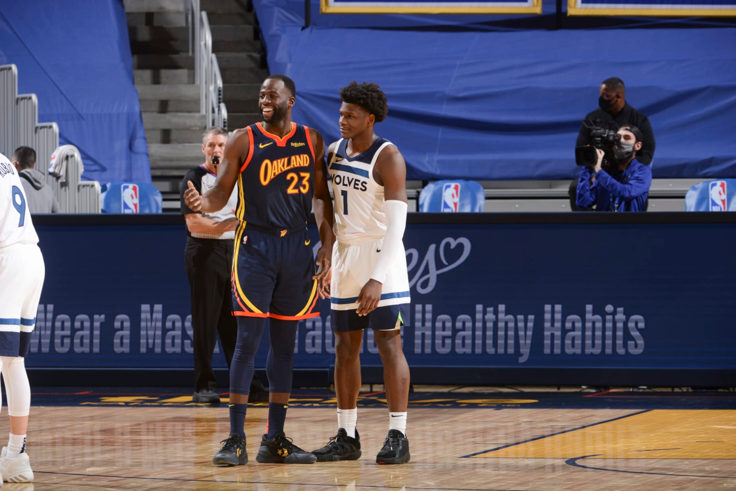 SAN FRANCISCO, CA - JANUARY 27: Draymond Green #23 of the Golden State Warriors and Anthony Edwards #1 of the Minnesota Timberwolves look on during the game  on January 27, 2021 at Chase Center in San Francisco, California. NOTE TO USER: User expressly acknowledges and agrees that, by downloading and or using this photograph, user is consenting to the terms and conditions of Getty Images License Agreement. Mandatory Copyright Notice: Copyright 2021 NBAE (Photo by Noah Graham/NBAE via Getty Images)