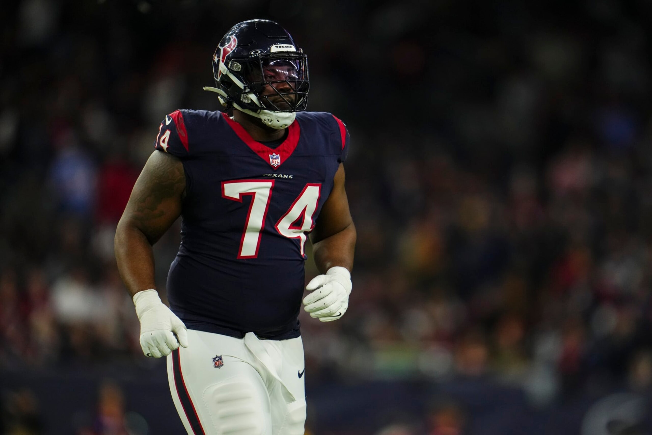 HOUSTON, TX - JANUARY 13: Josh Jones #74 of the Houston Texans runs across the field during an NFL wild-card playoff football game against the Cleveland Browns at NRG Stadium on January 13, 2024 in Houston, Texas. (Photo by Cooper Neill/Getty Images)