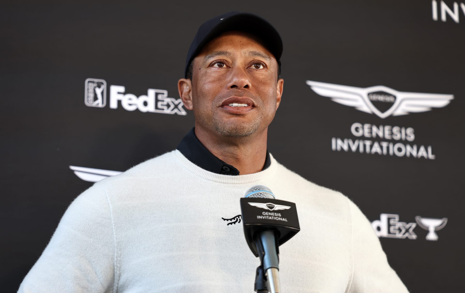 PACIFIC PALISADES, CALIFORNIA - FEBRUARY 15: Tiger Woods of the United States speaks during a press conference after his round during the first round of The Genesis Invitational at Riviera Country Club on February 15, 2024 in Pacific Palisades, California. (Photo by Michael Owens/Getty Images)