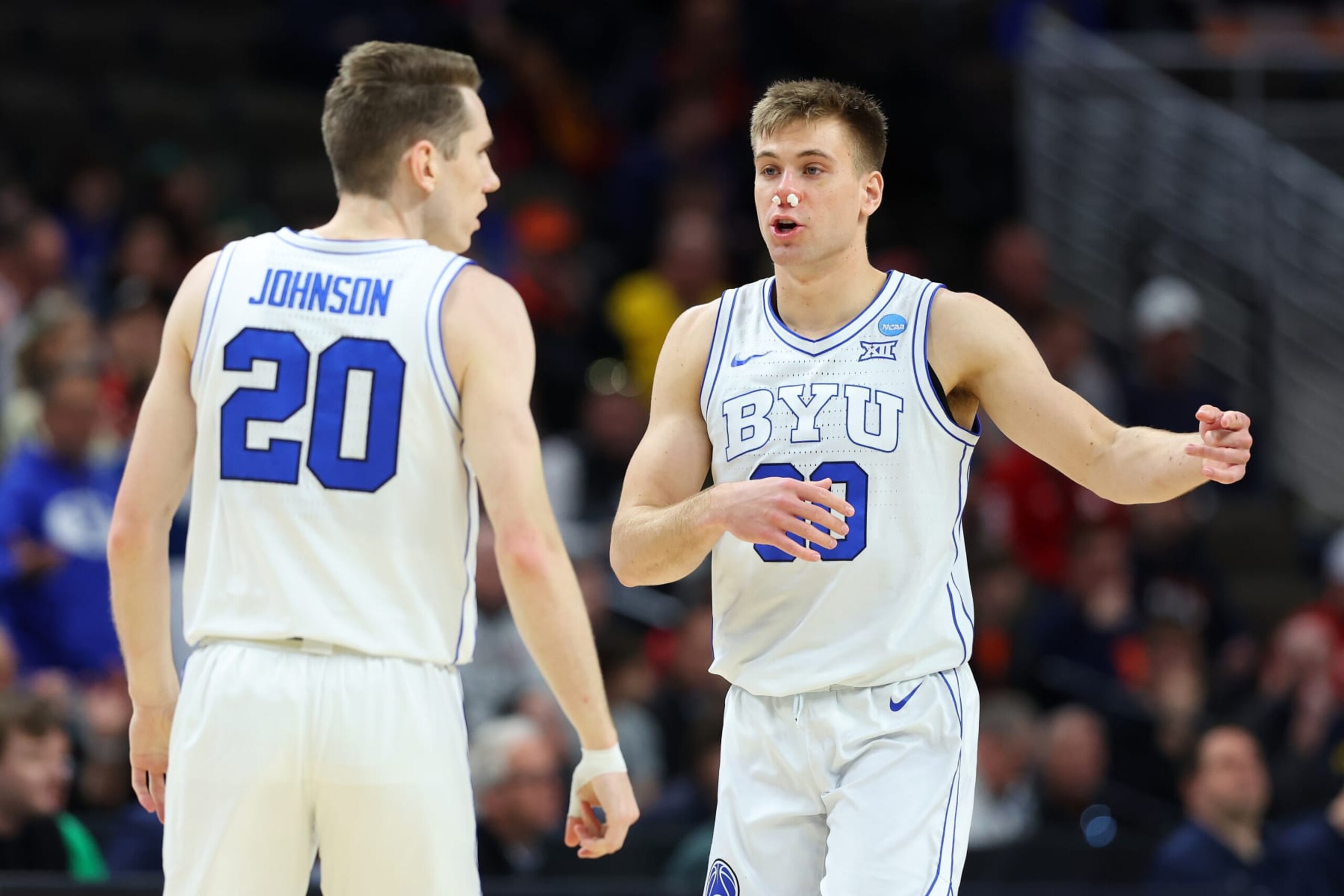 OMAHA, NEBRASKA - MARCH 21: Spencer Johnson #20 and Dallin Hall #30 of the Brigham Young Cougars talk during the game against the Duquesne Dukes in the first round of the NCAA Men's Basketball Tournament at CHI Health Center on March 21, 2024 in Omaha, Nebraska. (Photo by Michael Reaves/Getty Images) OMAHA, NEBRASKA - MARCH 21: Spencer Johnson #20 and Dallin Hall #30 of the Brigham Young Cougars talk during the game against the Duquesne Dukes in the first round of the NCAA Men's Basketball Tournament at CHI Health Center on March 21, 2024 in Omaha, Nebraska. (Photo by Michael Reaves/Getty Images)