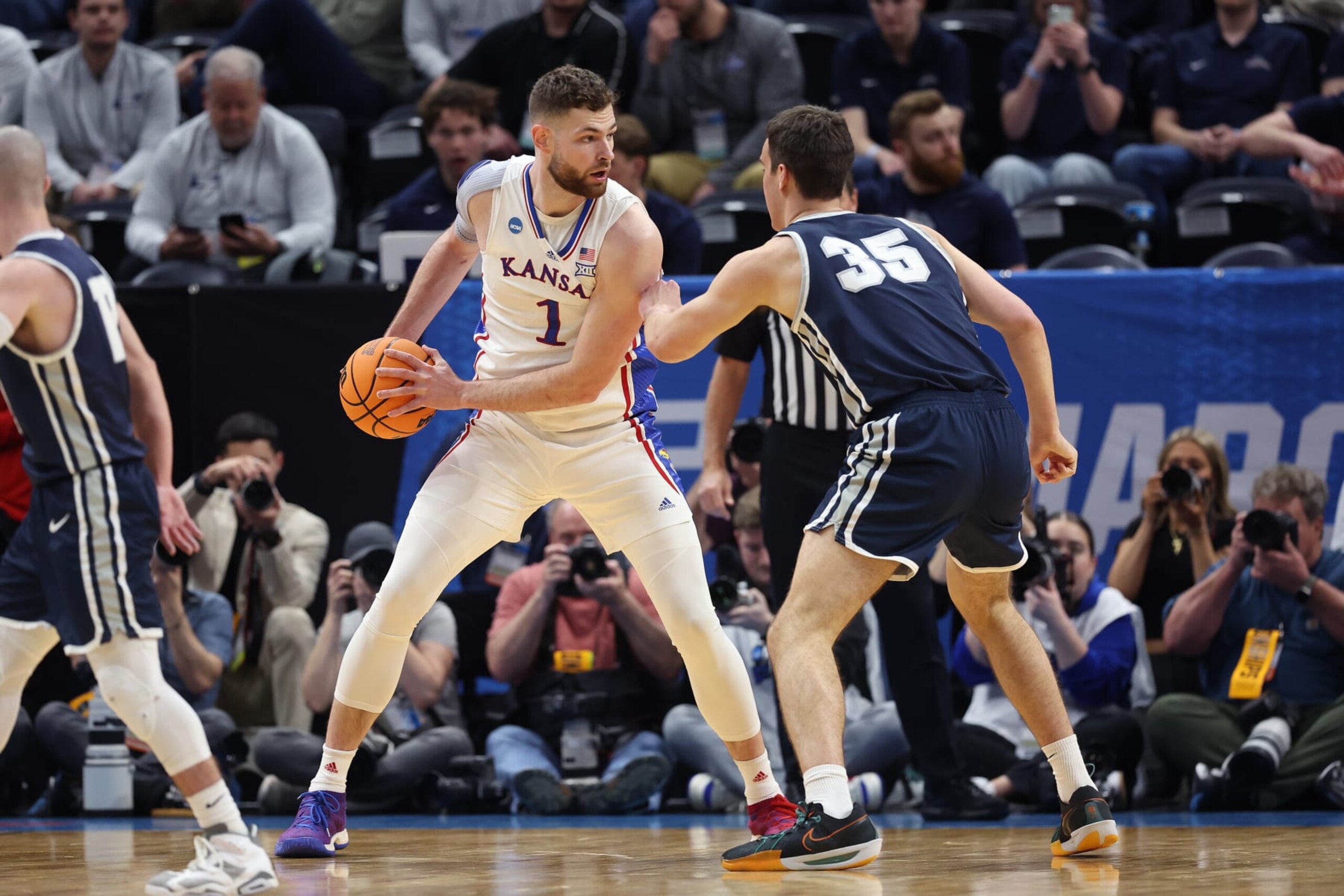 SALT LAKE CITY, UTAH - MARCH 21: Hunter Dickinson #1 of the Kansas Jayhawks is defended by Riley Allenspach #35 of the Samford Bulldogs during the first half in the first round of the NCAA Men's Basketball Tournament at Delta Center on March 21, 2024 in Salt Lake City, Utah. (Photo by Christian Petersen/Getty Images) SALT LAKE CITY, UTAH - MARCH 21: Hunter Dickinson #1 of the Kansas Jayhawks is defended by Riley Allenspach #35 of the Samford Bulldogs during the first half in the first round of the NCAA Men's Basketball Tournament at Delta Center on March 21, 2024 in Salt Lake City, Utah. (Photo by Christian Petersen/Getty Images)