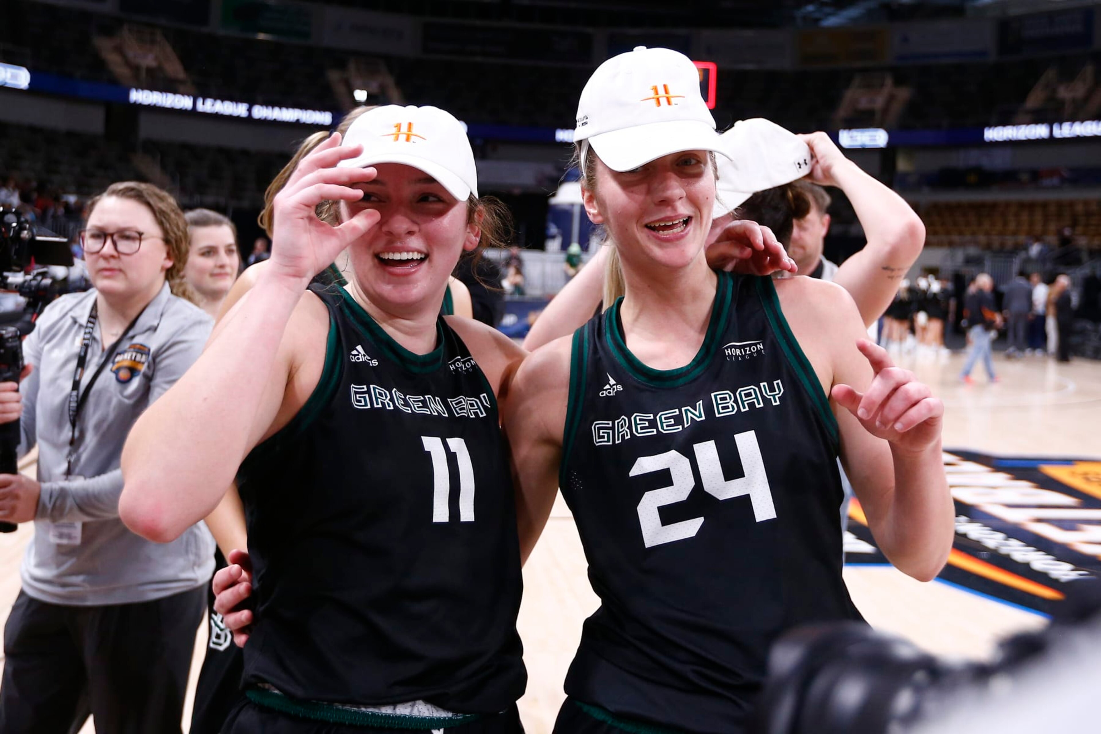 INDIANAPOLIS, IN - MARCH 12: Green Bay Phoenix guard Natalie McNeal (11) and Green Bay Phoenix guard Natalie Andersen (24) celebrate winning the Horizon League Women's Championship game between the Cleveland State Vikings and the Green Bay Phoenix on March 12, 2024 at the Indiana Farmers Coliseum in Indianapolis, IN.(Photo by Jeffrey Brown/Icon Sportswire via Getty Images)