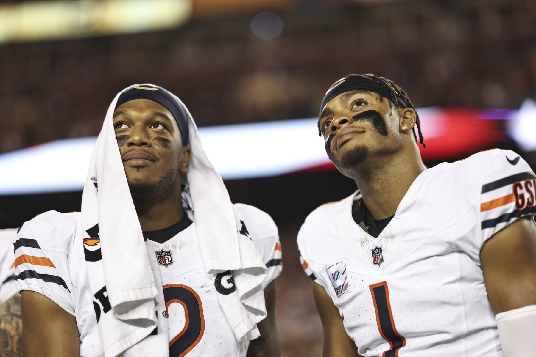 LANDOVER, MARYLAND - OCTOBER 05: DJ Moore #2 of the Chicago Bears and Justin Fields #1 of the Chicago Bears react as they look on prior to an NFL football game between the Washington Commanders and the Chicago Bears at FedExField on October 05, 2023 in Landover, Maryland. (Photo by Michael Owens/Getty Images)