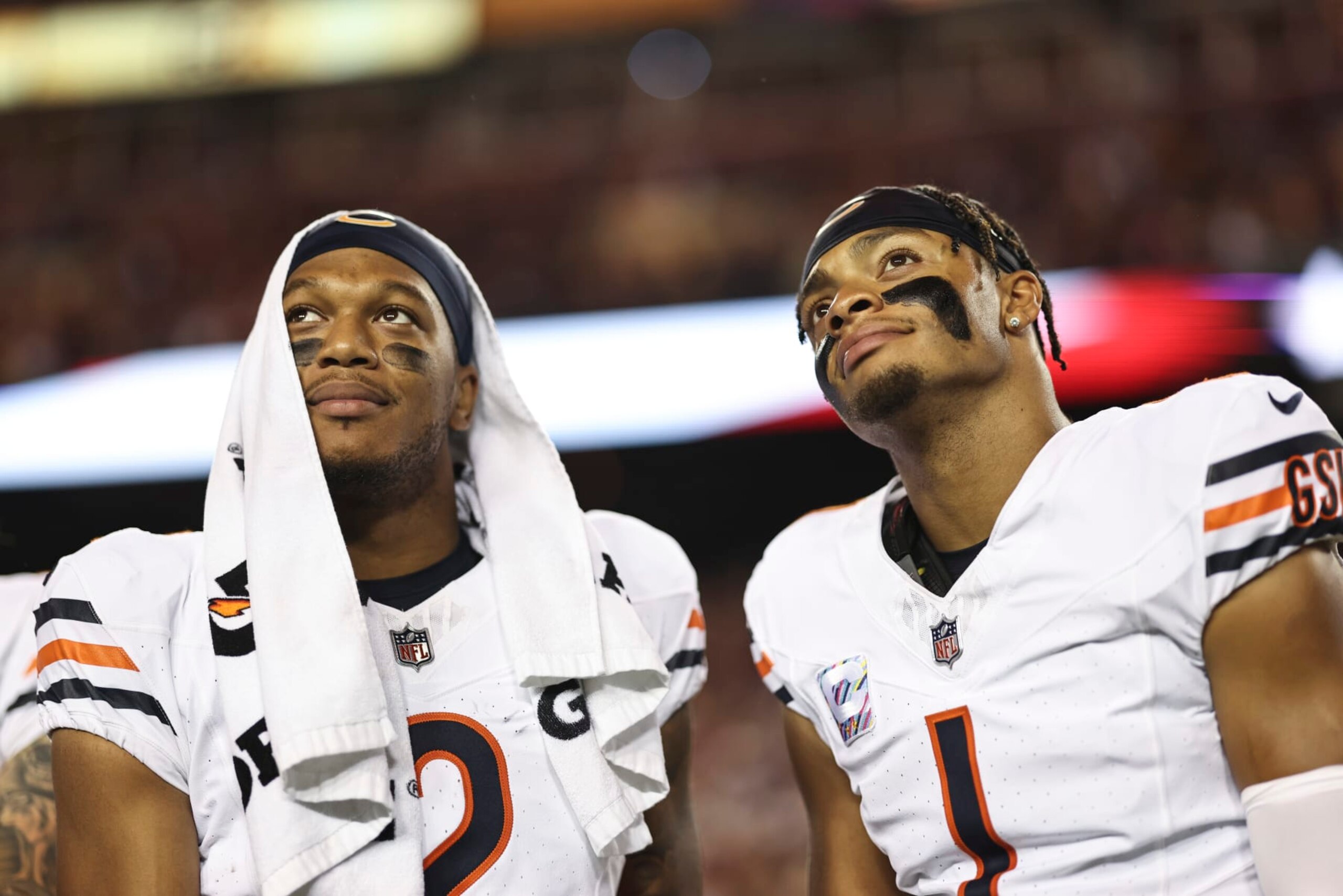 LANDOVER, MARYLAND - OCTOBER 05: DJ Moore #2 of the Chicago Bears and Justin Fields #1 of the Chicago Bears react as they look on prior to an NFL football game between the Washington Commanders and the Chicago Bears at FedExField on October 05, 2023 in Landover, Maryland. (Photo by Michael Owens/Getty Images)