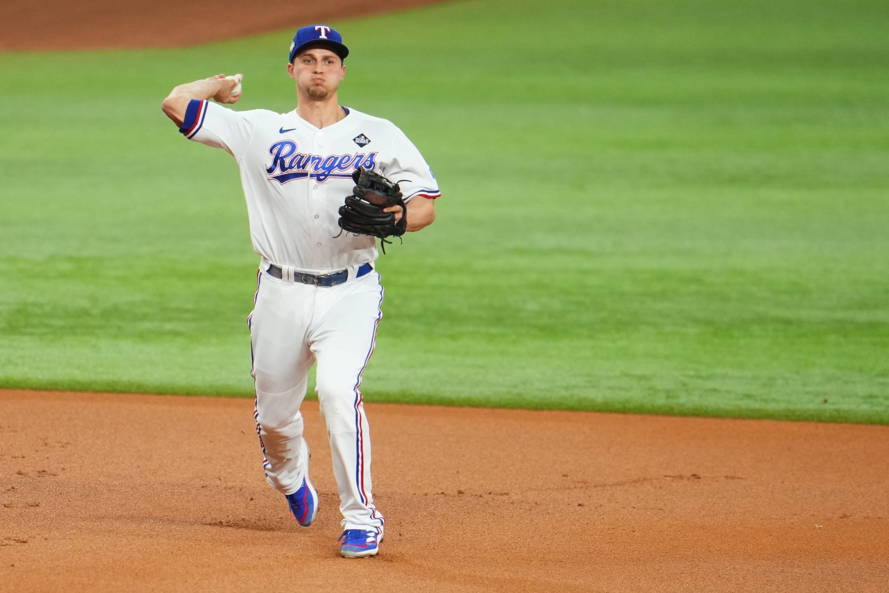 ARLINGTON, TX - OCTOBER 28: Corey Seager #5 of the Texas Rangers throws to first during Game 2 of the 2023 World Series between the Arizona Diamondbacks and the Texas Rangers at Globe Life Field on Saturday, October 28, 2023 in Arlington, Texas. (Photo by Cooper Neill/MLB Photos via Getty Images)