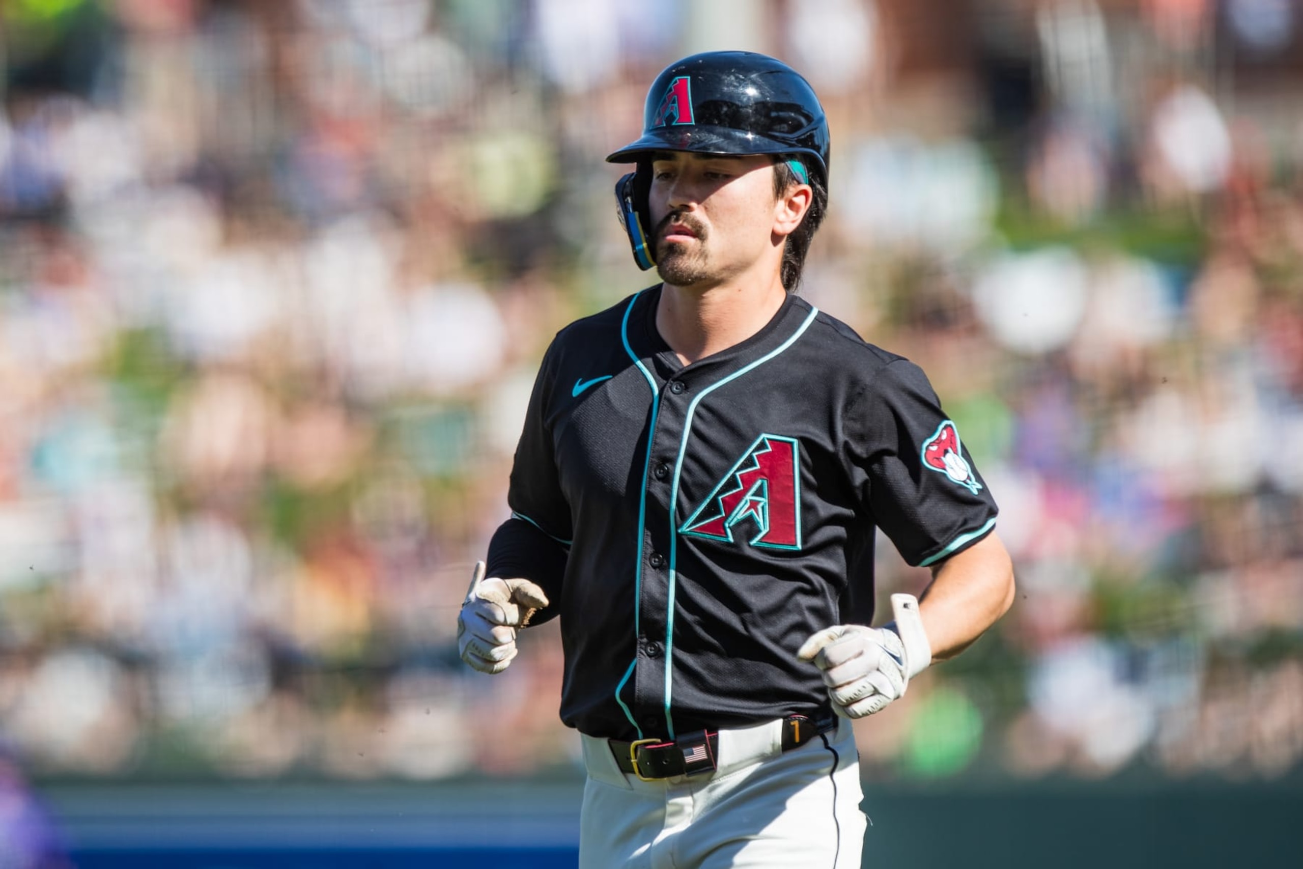 SCOTTSDALE, ARIZONA - MARCH 13: Corbin Carroll #7 of the Arizona Diamondbacks runs to the dugout during the Spring Training game against the Colorado Rockies at Salt River Fields at Talking Stick on March 13, 2024 in Scottsdale, Arizona. (Photo by John E. Moore III/Getty Images)