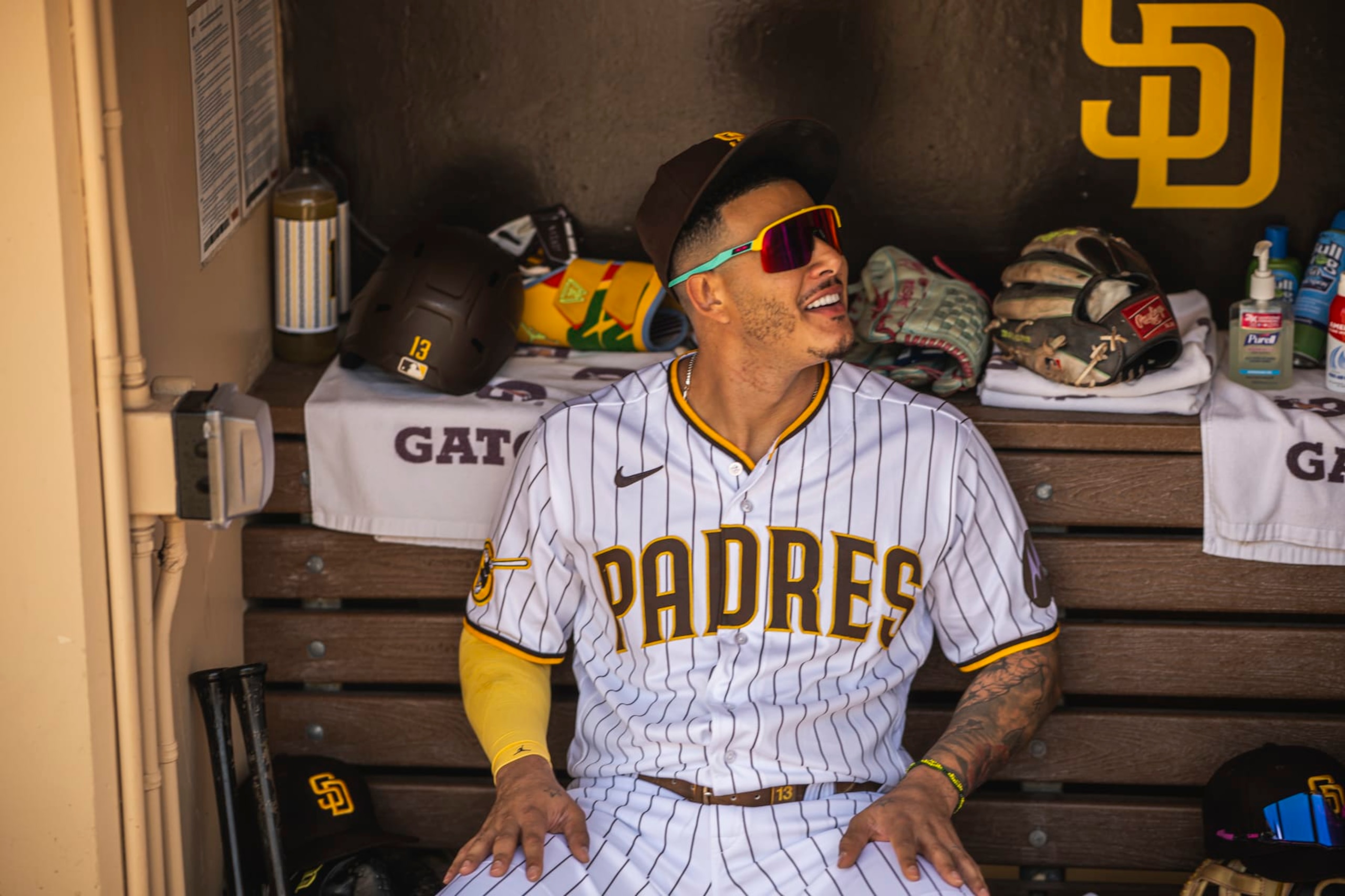 SAN DIEGO, CA - AUGUST 23: Manny Machado #13 of the San Diego Padres sits in the dugout before the game  against the Miami Marlins on August 23, 2023 at Petco Park in San Diego, California. (Photo by Matt Thomas/San Diego Padres/Getty Images)