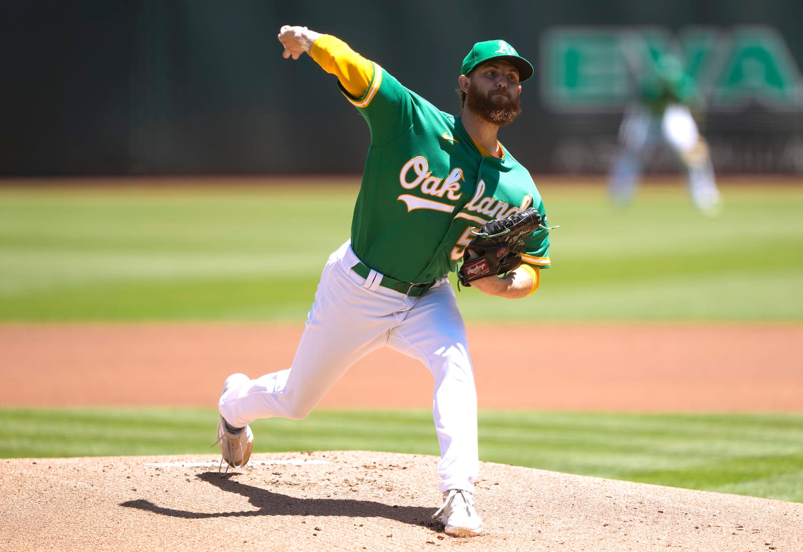 OAKLAND, CALIFORNIA - JULY 24: Paul Blackburn #58 of the Oakland Athletics pitches against the Texas Rangers in the top of the first inning at RingCentral Coliseum on July 24, 2022 in Oakland, California. (Photo by Thearon W. Henderson/Getty Images)