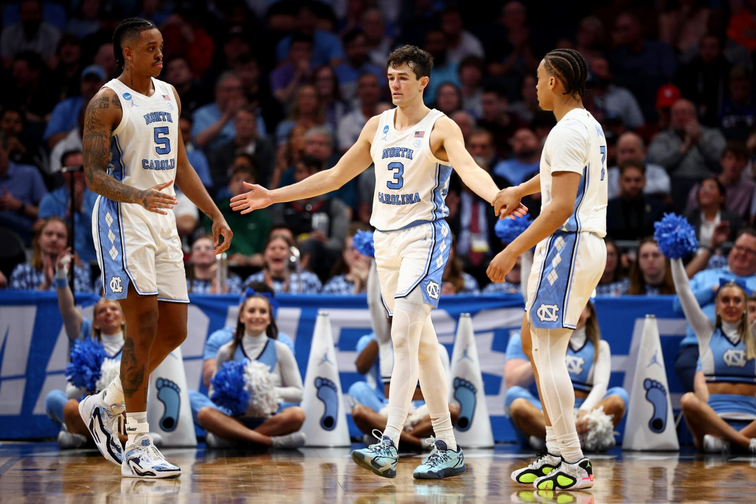 CHARLOTTE, NORTH CAROLINA - MARCH 21: Cormac Ryan #3 of the North Carolina Tar Heels celebrates with Armando Bacot #5 and Seth Trimble #7 against the Wagner Seahawks during the second half in the first round of the NCAA Men's Basketball Tournament at Spectrum Center on March 21, 2024 in Charlotte, North Carolina. (Photo by Jared C. Tilton/Getty Images)