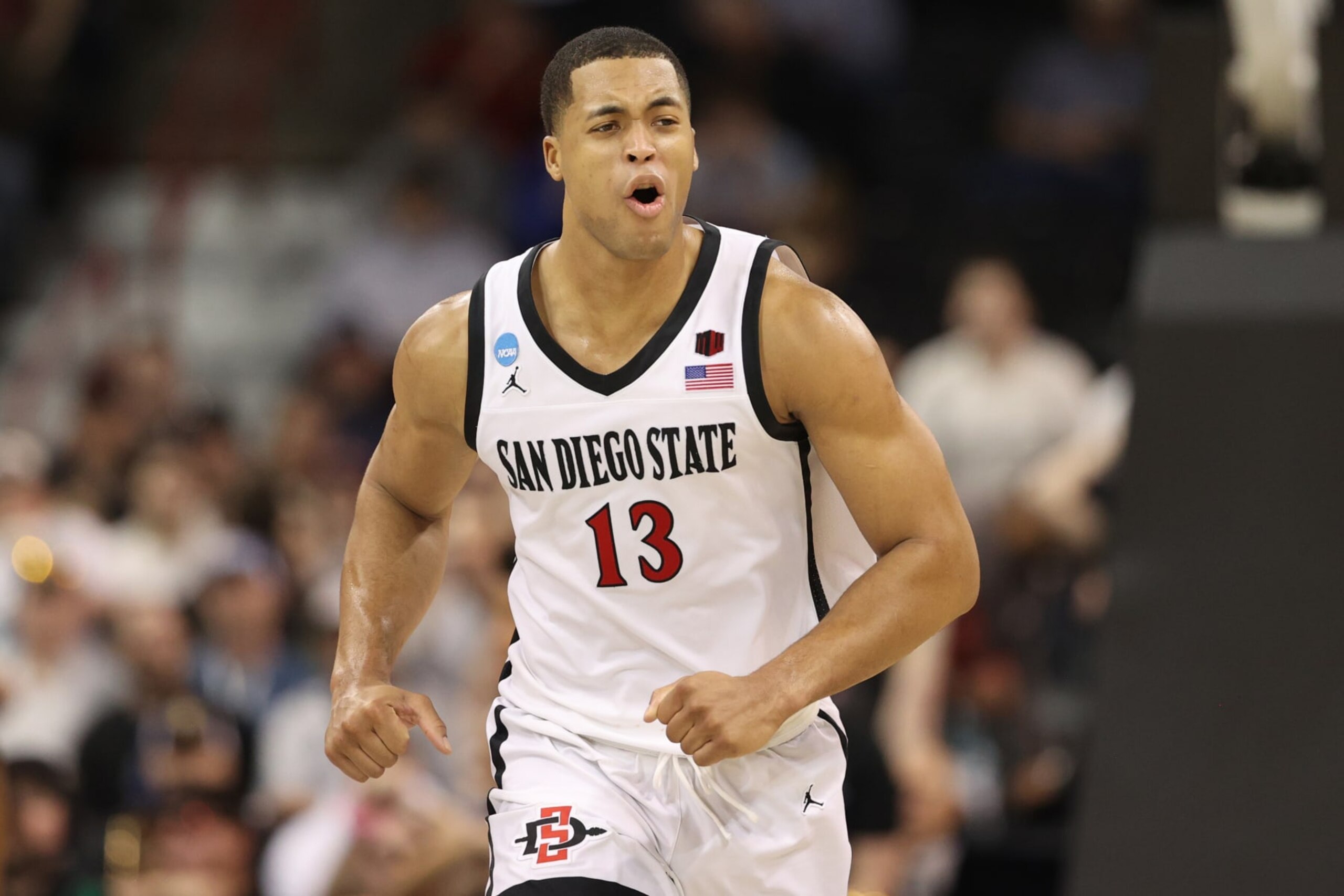 SPOKANE, WASHINGTON - MARCH 22: Jaedon LeDee #13 of the San Diego State Aztecs reacts during the second half against the UAB Blazers in the first round of the NCAA Men's Basketball Tournament at Spokane Veterans Memorial Arena on March 22, 2024 in Spokane, Washington. (Photo by Steph Chambers/Getty Images)