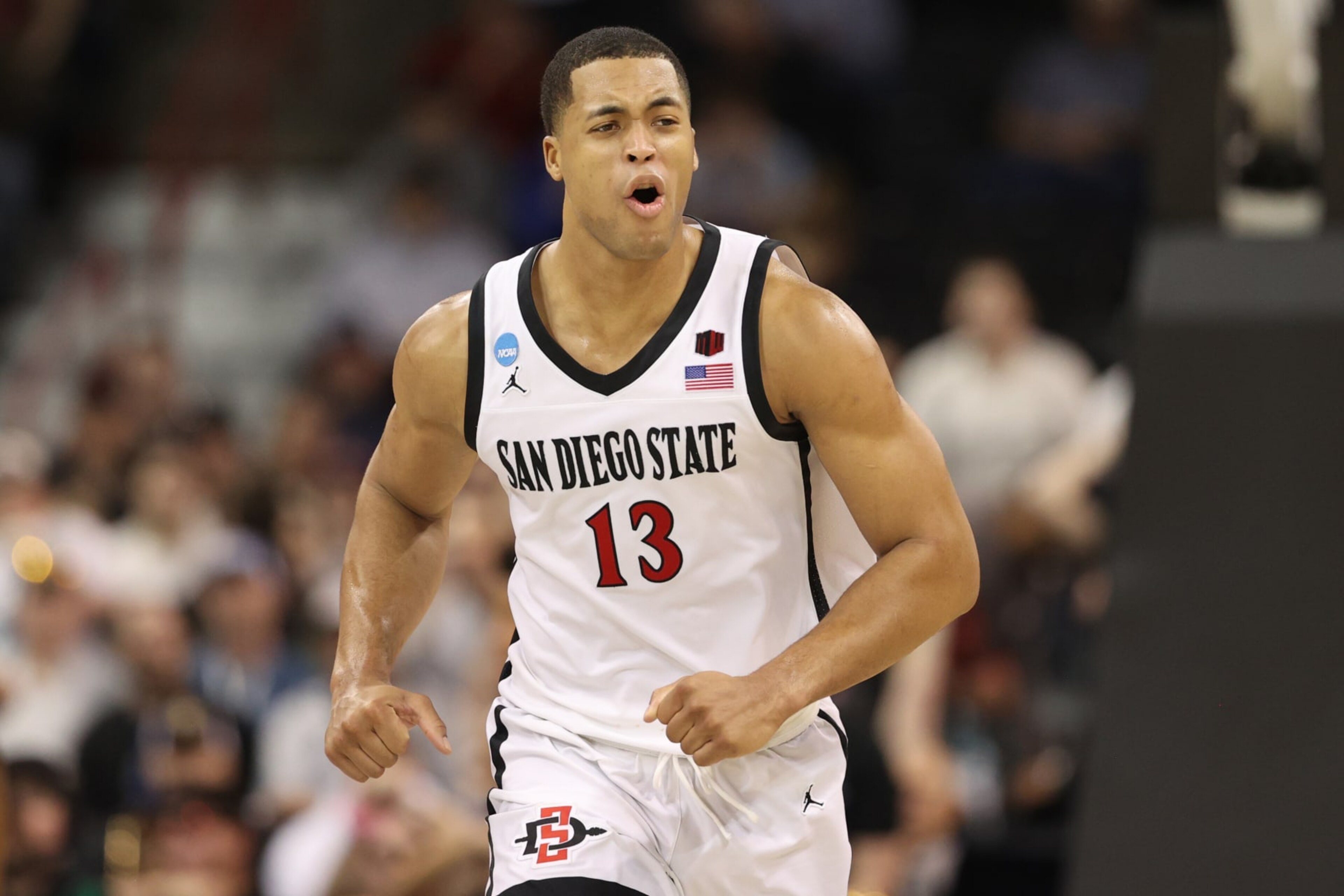 SPOKANE, WASHINGTON - MARCH 22: Jaedon LeDee #13 of the San Diego State Aztecs reacts during the second half against the UAB Blazers in the first round of the NCAA Men's Basketball Tournament at Spokane Veterans Memorial Arena on March 22, 2024 in Spokane, Washington. (Photo by Steph Chambers/Getty Images)