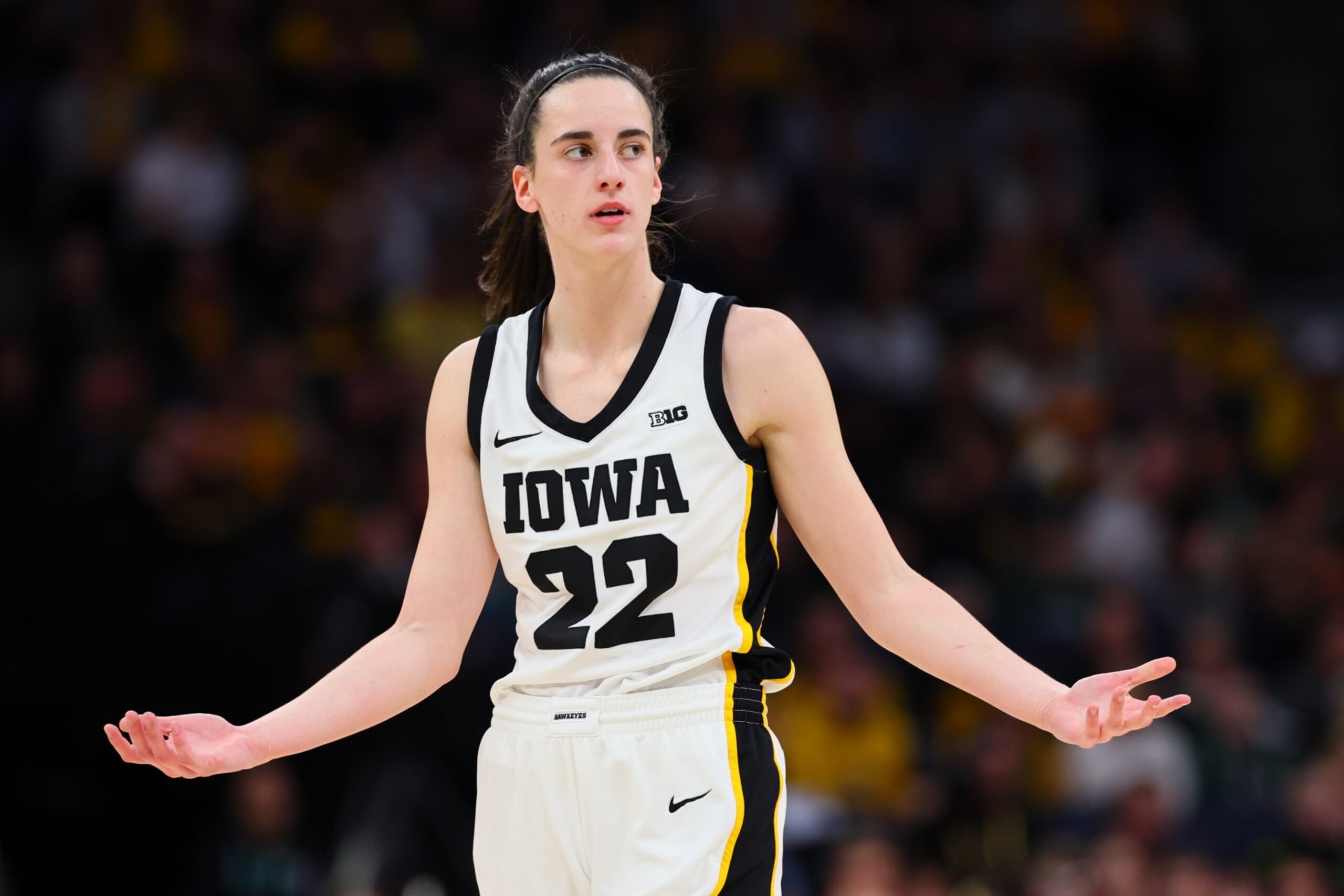 MINNEAPOLIS, MINNESOTA - MARCH 10: Caitlin Clark #22 of the Iowa Hawkeyes reacts in the first half against the Nebraska Cornhuskers during the Big Ten Women's Basketball Tournament Championship at Target Center on March 10, 2024 in Minneapolis, Minnesota. (Photo by Adam Bettcher/Getty Images) MINNEAPOLIS, MINNESOTA - MARCH 10: Caitlin Clark #22 of the Iowa Hawkeyes reacts in the first half against the Nebraska Cornhuskers during the Big Ten Women's Basketball Tournament Championship at Target Center on March 10, 2024 in Minneapolis, Minnesota. (Photo by Adam Bettcher/Getty Images)