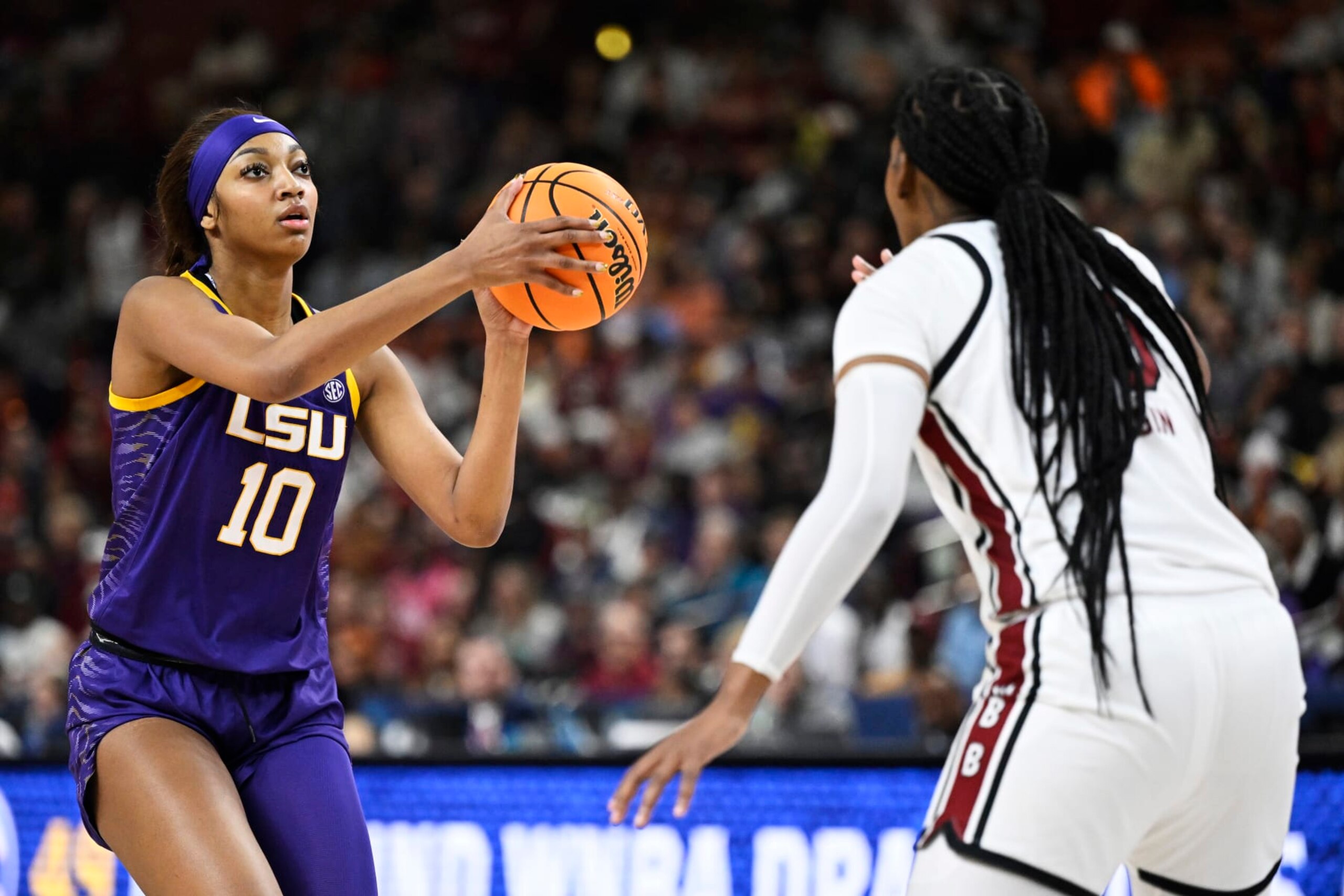 GREENVILLE, SOUTH CAROLINA - MARCH 10: Angel Reese #10 of the LSU Lady Tigers shoots a basket against Sania Feagin #20 of the South Carolina Gamecocks in the second quarter during the championship game of the SEC Women's Basketball Tournament at Bon Secours Wellness Arena on March 10, 2024 in Greenville, South Carolina. (Photo by Eakin Howard/Getty Images) GREENVILLE, SOUTH CAROLINA - MARCH 10: Angel Reese #10 of the LSU Lady Tigers shoots a basket against Sania Feagin #20 of the South Carolina Gamecocks in the second quarter during the championship game of the SEC Women's Basketball Tournament at Bon Secours Wellness Arena on March 10, 2024 in Greenville, South Carolina. (Photo by Eakin Howard/Getty Images)