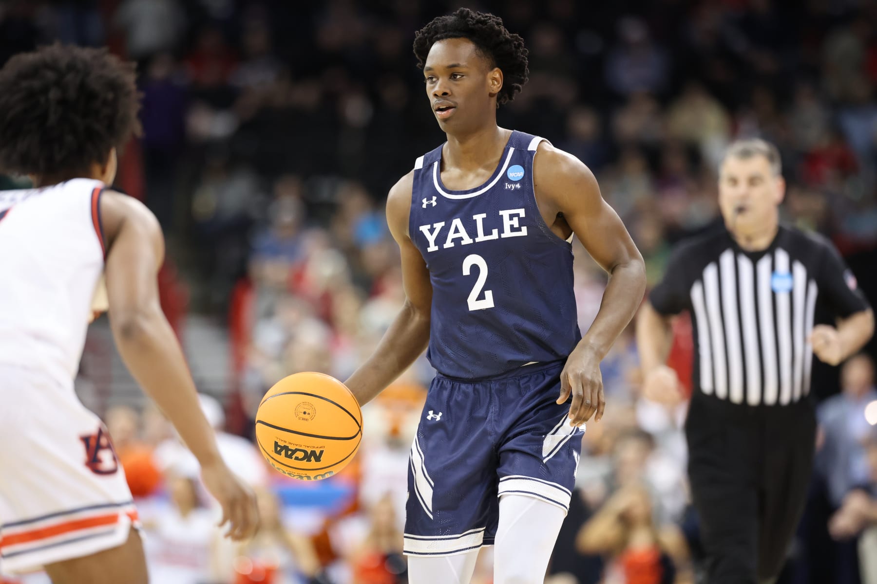 SPOKANE, WASHINGTON - MARCH 22: Bez Mbeng #2 of the Yale Bulldogs dribbles the ball against an Auburn Tigers defender during the first round of the 2024 NCAA Men's Basketball Tournament held at Spokane Veterans Memorial Arena on March 22, 2024 in Spokane, Washington. (Photo by C. Morgan Engel/NCAA Photos via Getty Images)