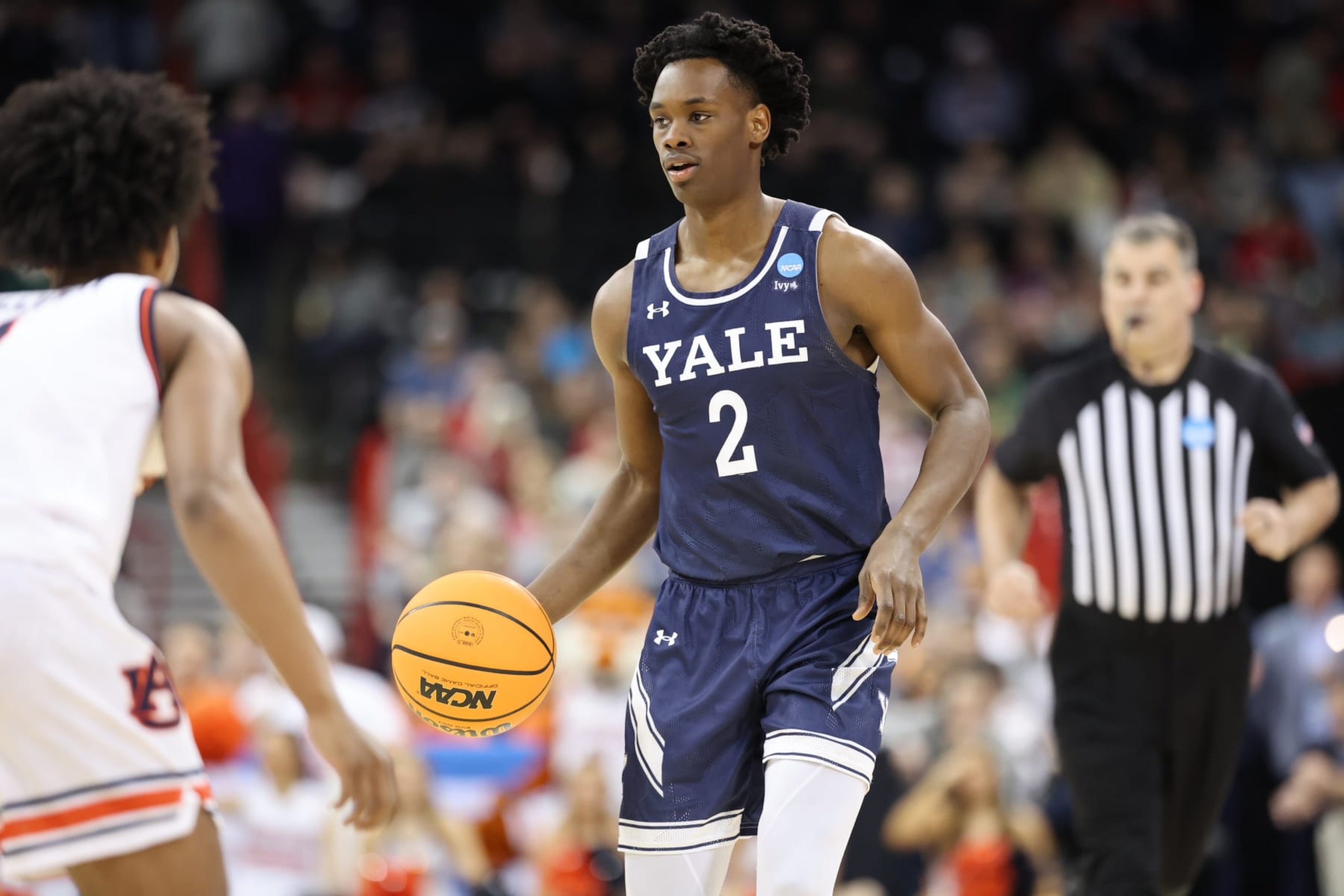 SPOKANE, WASHINGTON - MARCH 22: Bez Mbeng #2 of the Yale Bulldogs dribbles the ball against an Auburn Tigers defender during the first round of the 2024 NCAA Men's Basketball Tournament held at Spokane Veterans Memorial Arena on March 22, 2024 in Spokane, Washington. (Photo by C. Morgan Engel/NCAA Photos via Getty Images)