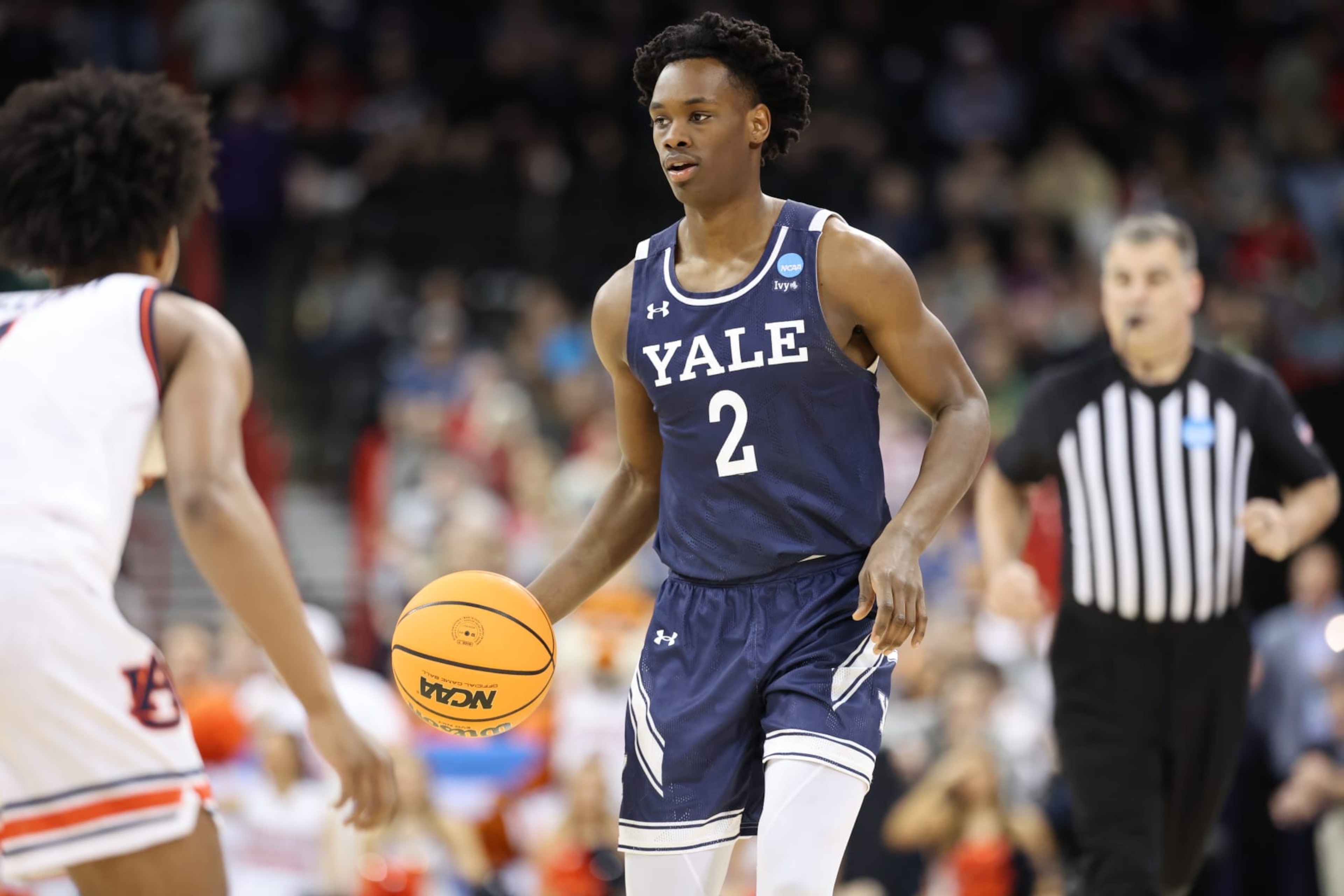 SPOKANE, WASHINGTON - MARCH 22: Bez Mbeng #2 of the Yale Bulldogs dribbles the ball against an Auburn Tigers defender during the first round of the 2024 NCAA Men's Basketball Tournament held at Spokane Veterans Memorial Arena on March 22, 2024 in Spokane, Washington. (Photo by C. Morgan Engel/NCAA Photos via Getty Images)