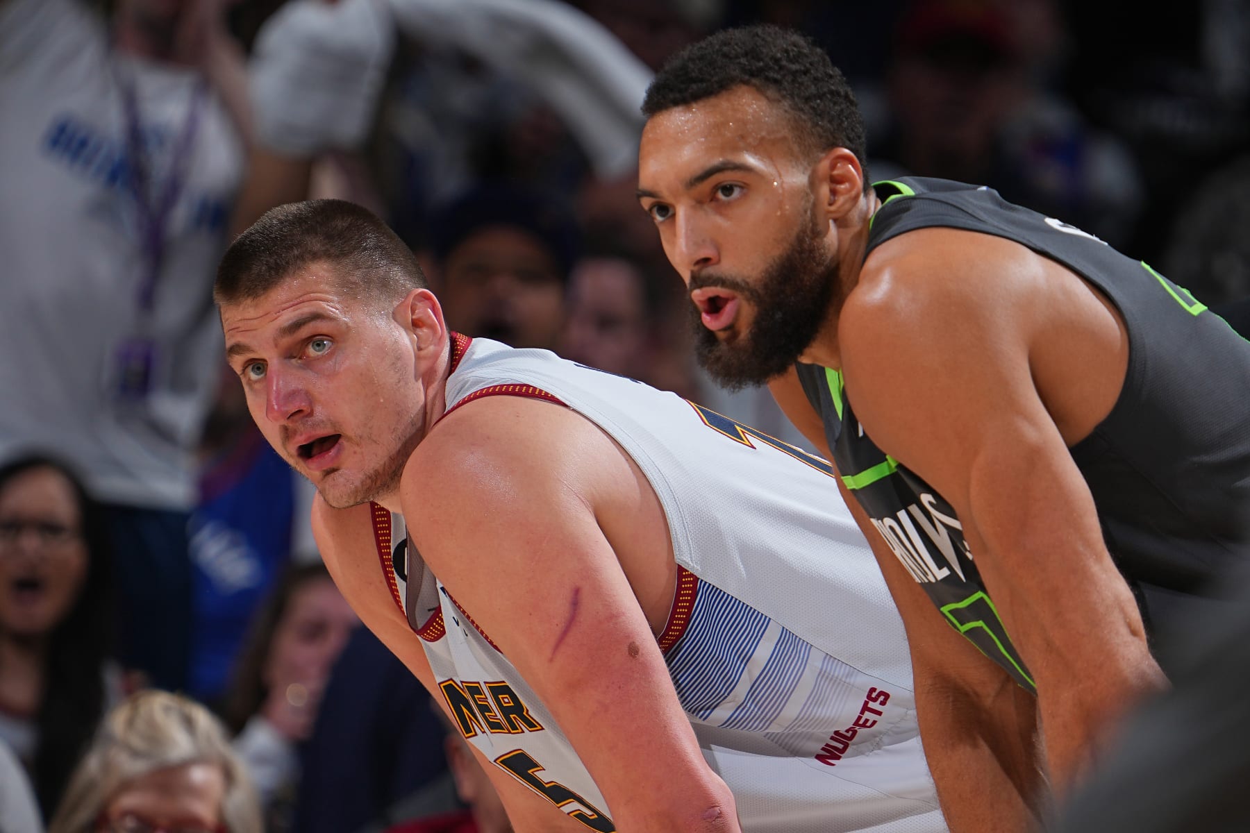 DENVER, CO - APRIL 25: Nikola Jokic #15 of the Denver Nuggets and Rudy Gobert #27 of the Minnesota Timberwolves look on during Round 1 Game 5 of the 2023 NBA Playoffs on April 25, 2023 at the Ball Arena in Denver, Colorado. NOTE TO USER: User expressly acknowledges and agrees that, by downloading and/or using this Photograph, user is consenting to the terms and conditions of the Getty Images License Agreement. Mandatory Copyright Notice: Copyright 2023 NBAE (Photo by Bart Young/NBAE via Getty Images)