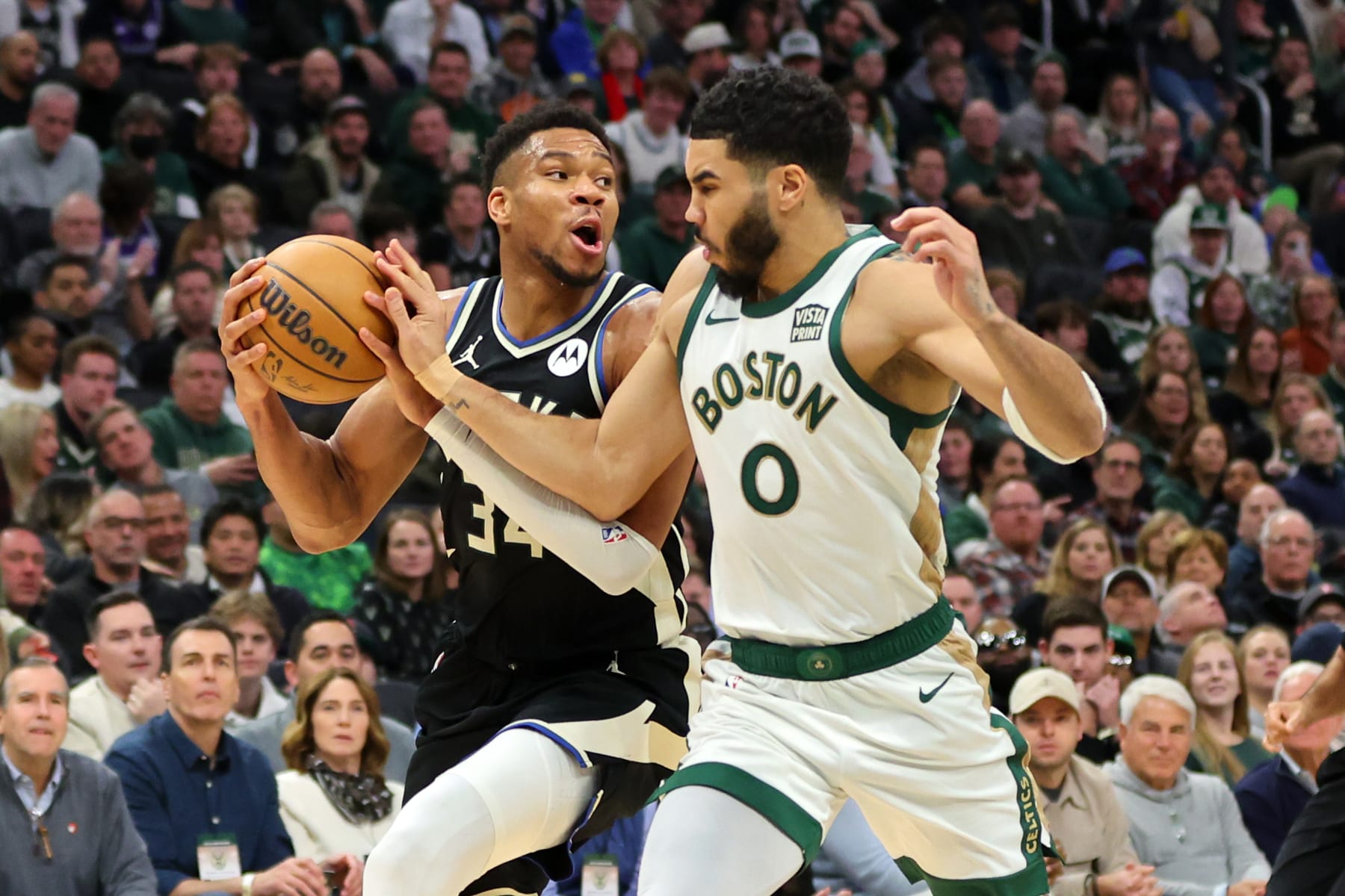 MILWAUKEE, WISCONSIN - JANUARY 11: Giannis Antetokounmpo #34 of the Milwaukee Bucks is defended by Jayson Tatum #0 of the Boston Celtics during a game at Fiserv Forum on January 11, 2024 in Milwaukee, Wisconsin.  The Bucks defeated the Celtics 135 - 102.  NOTE TO USER: User expressly acknowledges and agrees that, by downloading and or using this photograph, User is consenting to the terms and conditions of the Getty Images License Agreement. (Photo by Stacy Revere/Getty Images)