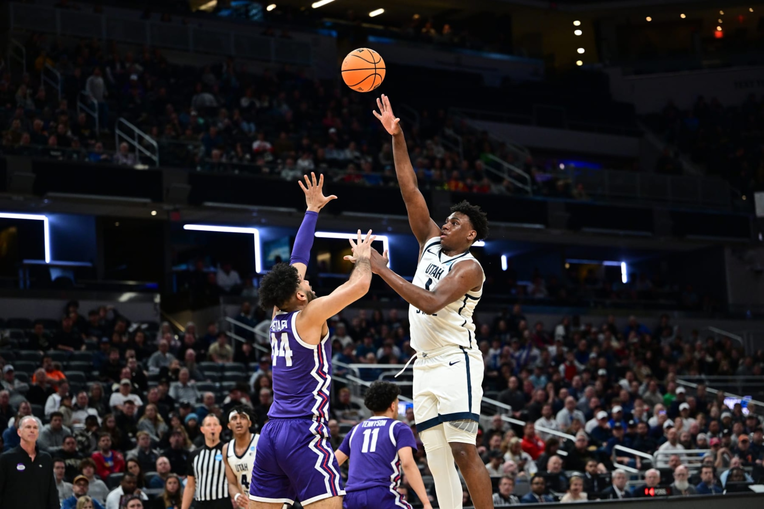 INDIANAPOLIS, INDIANA - MARCH 22: Great Osobor #1 of the Utah State Aggies shoot the ball over Essam Mostafa #44 of the TCU Horned Frogs during the first round of the 2024 NCAA Men's Basketball Tournament held at Gainbridge Fieldhouse on March 22, 2024 in Indianapolis, Indiana. (Photo by Ben Solomon/NCAA Photos via Getty Images)