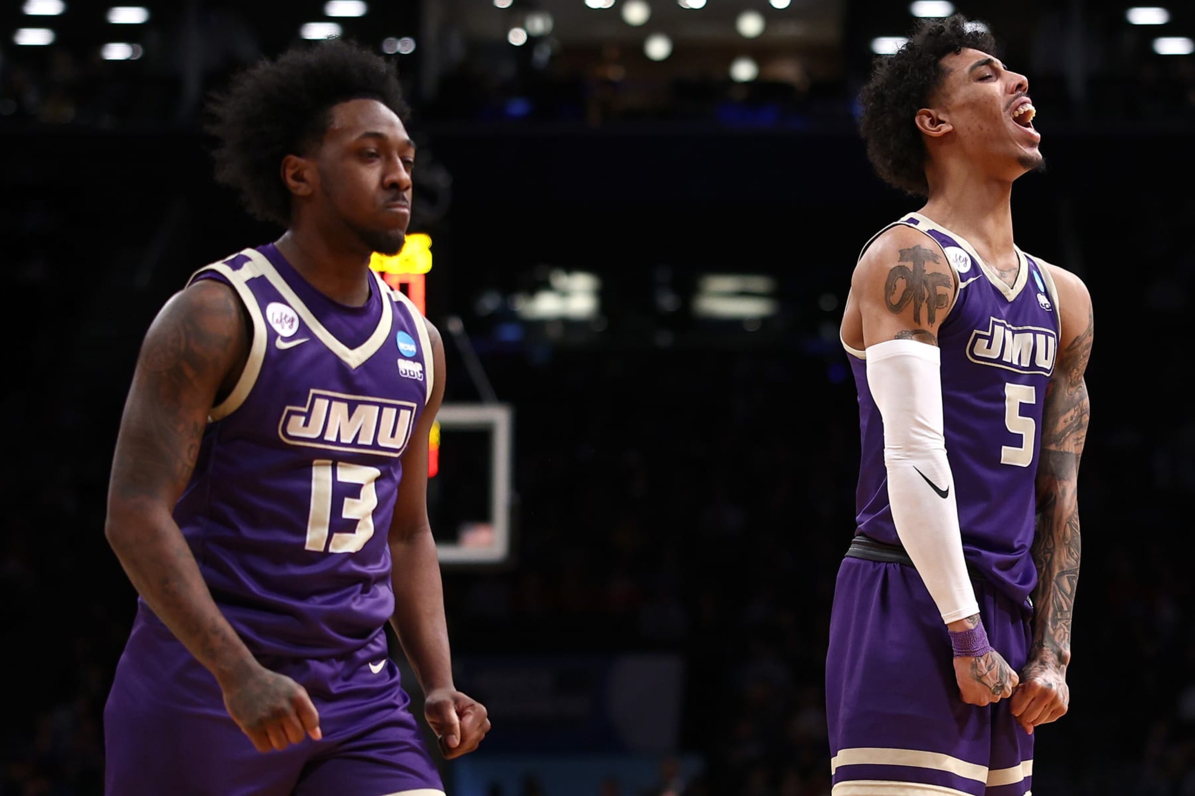 NEW YORK, NEW YORK - MARCH 22: Terrence Edwards Jr. #5 and Michael Green III #13 of the James Madison Dukes react during the first half against the Wisconsin Badgers in the first round of the NCAA Men's Basketball Tournament at Barclays Center on March 22, 2024 in New York City. (Photo by Elsa/Getty Images)